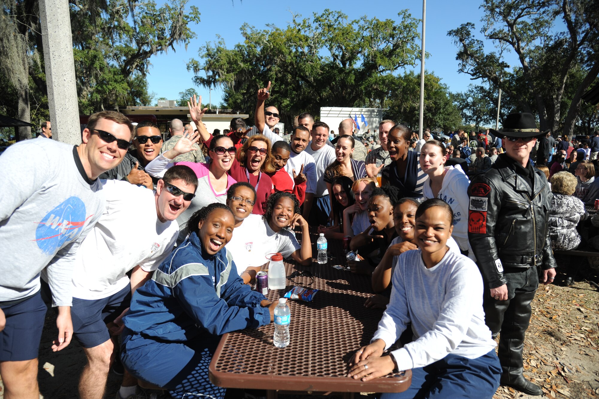 Members of the 335th Training Squadron smile for the camera at the consolidated unit inspection celebration picnic Nov. 7, 2012, at the Marina Park, Keesler Air Force Base, Miss.  The 81st Training Wing received an “Excellent” rating during the consolidated unit inspection, held Oct. 29-Nov. 2.  (U.S. Air Force photo by Kemberly Groue)