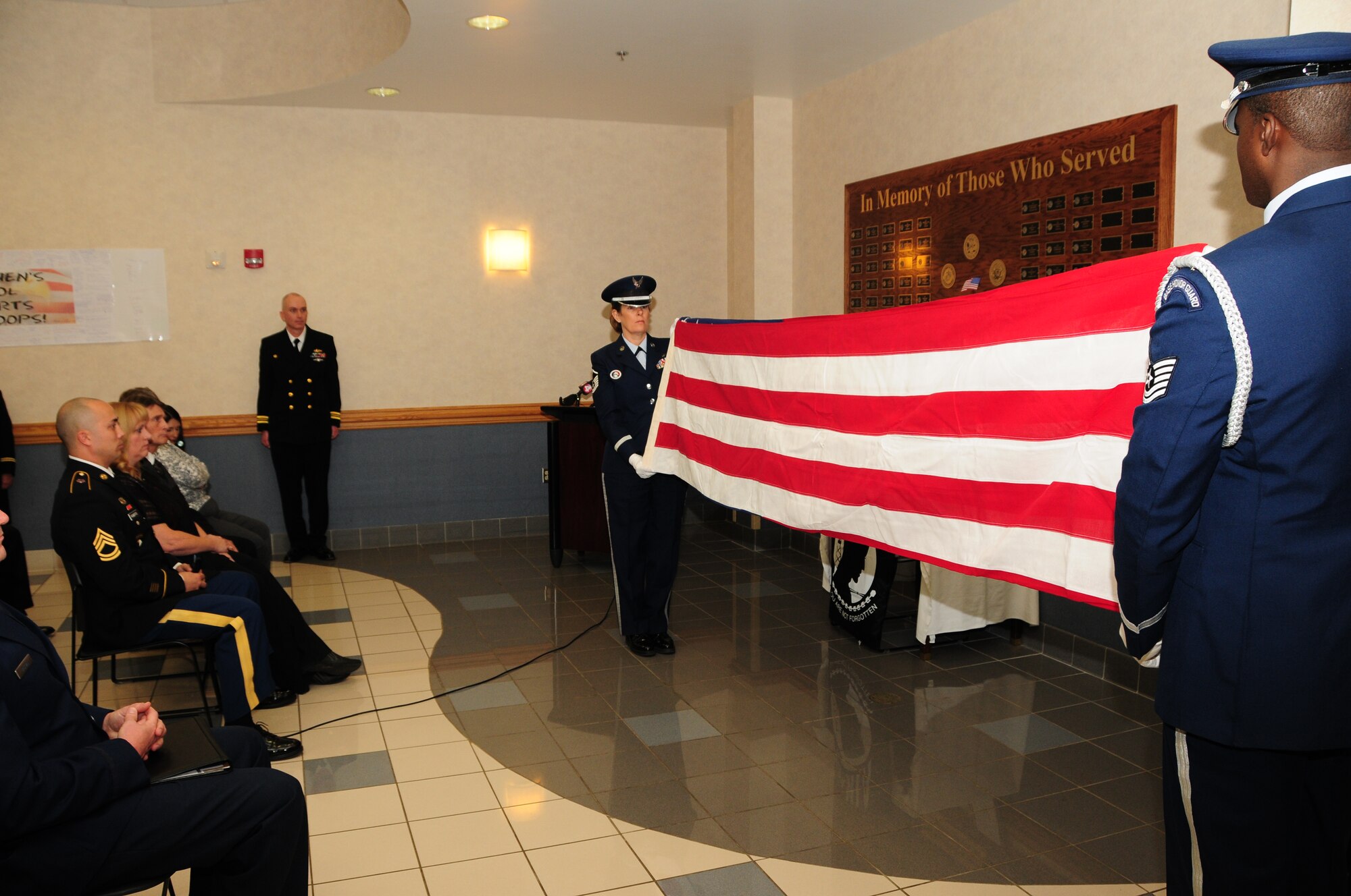 Niagara Falls Air Reserve Station Honor Guard perform the flag folding ceremony for family members of U.S. Army Sergeant Nathan A. Golllnitz in the Buffalo Military Entrance Processing Station located at the Niagara Falls, Air Reserve Station, N.Y. on November 9, 2012. Sgt. Gollnitz who payed the ultimate sacrifice in Afghanistan earlier this year was honored and had a room dedicated in his name. (U.S. Air Force photo by Peter Borys).