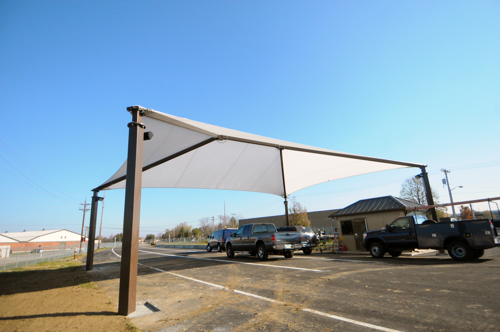 The project’s completion and the opening of the new Gate 1A is planned for Nov. 19. Already a white canopy sheltering the new gate’s prefabricated guard shack is complete.  (photo by Niki Jahns)