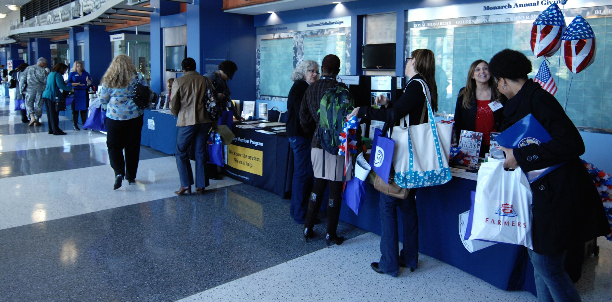 Participants of the education summit at Norfolk, Va., scan booths for information relevant to their individual needs, Nov. 1. Local schools, as well as organizations affiliated with the military, were present at the booths, giving participants the opportunity to network with members who represented both the local and military aspects of education. (U.S. Air Force Photo by Airman 1st Class Austin Harvill/Released)