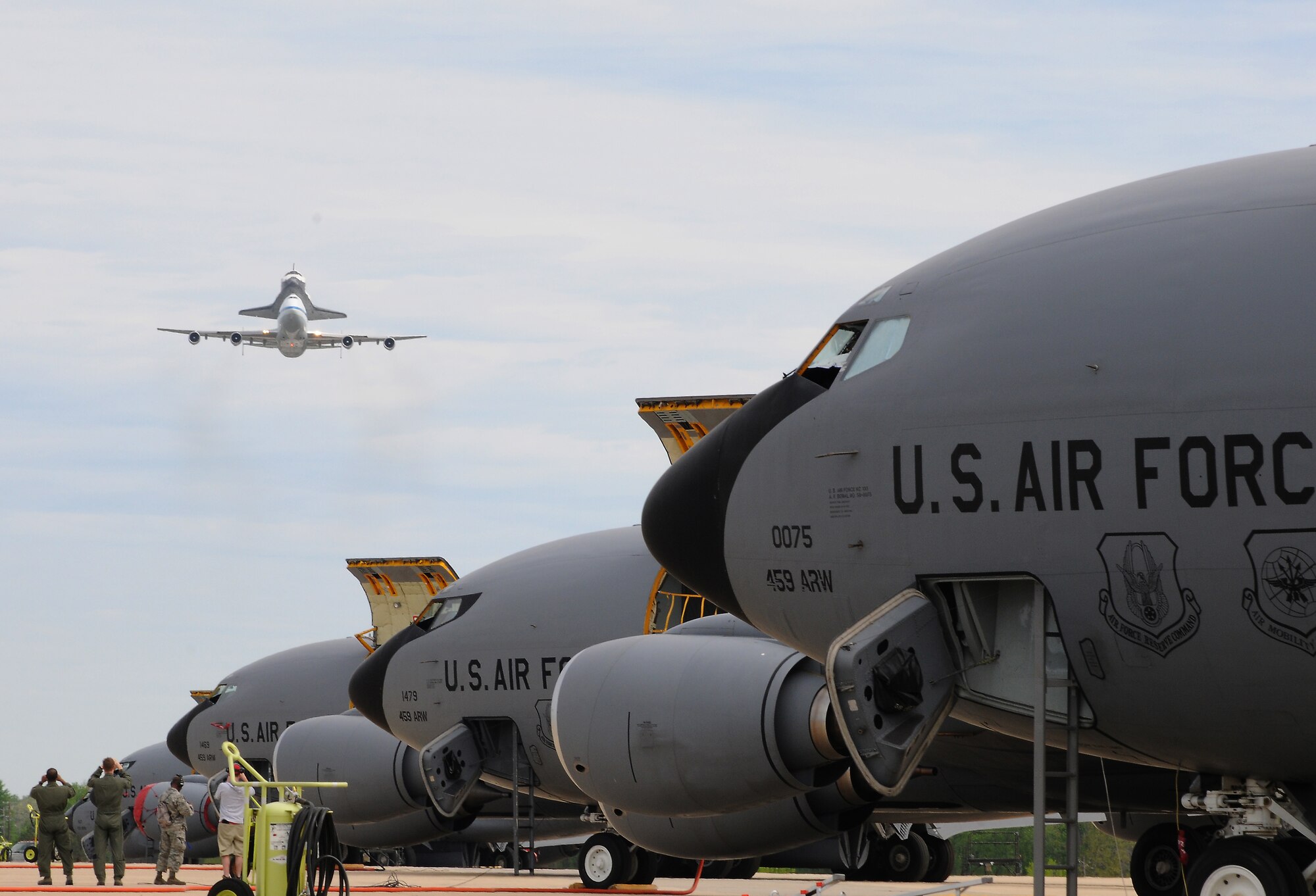 A NASA Shuttle Carrier Aircraft carrying the Space Shuttle Discovery performs a fly by, April 17, 2012 at Joint Base Andrews, Md. The aircraft landed at Washington Dulles International Airport in Sterling, Va., before its transfer to the National Air and Space Museum. Discovery completed 39 missions, spent 365 days in space, orbited the Earth 5,830 times, and traveled 148,221,675 miles .(U.S. Air Force photo/Senior Airman Katie Spencer) 