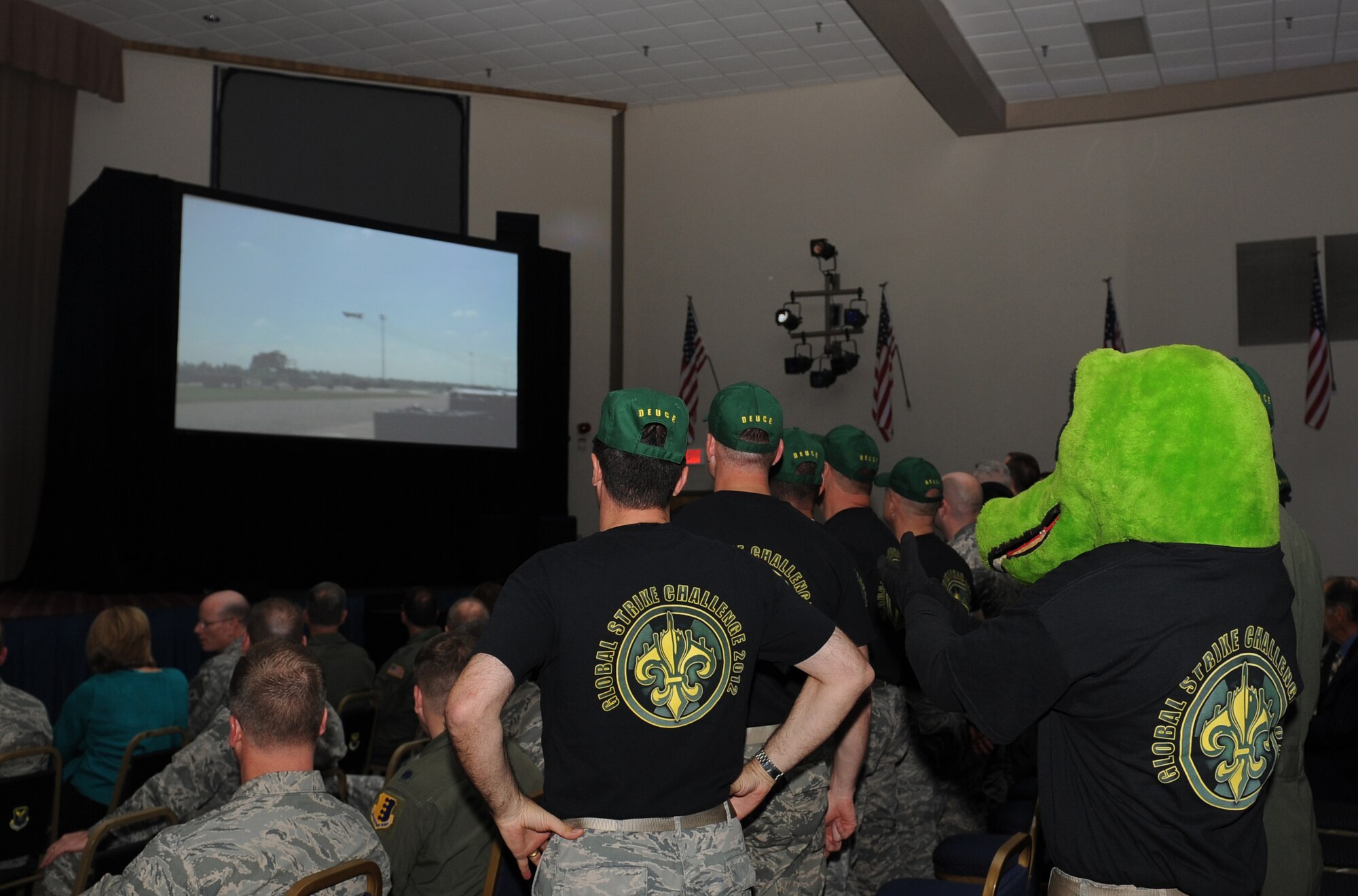 Members of the 2nd Bomb Wing watch a video showcasing the Wing's Airmen during the 2012 Air Force Global Strike Challenge score posting at Hoban Hall on Barksdale Air Force Base, La., Nov. 7. The Global Strike Challenge is a command-wide competition designed to enhance readiness, teamwork, esprit de corps, mission pride and a competitive spirit amongst its competitors. (U.S. Air Force photo/Airman 1st Class Benjamin Gonsier)(RELEASED)
