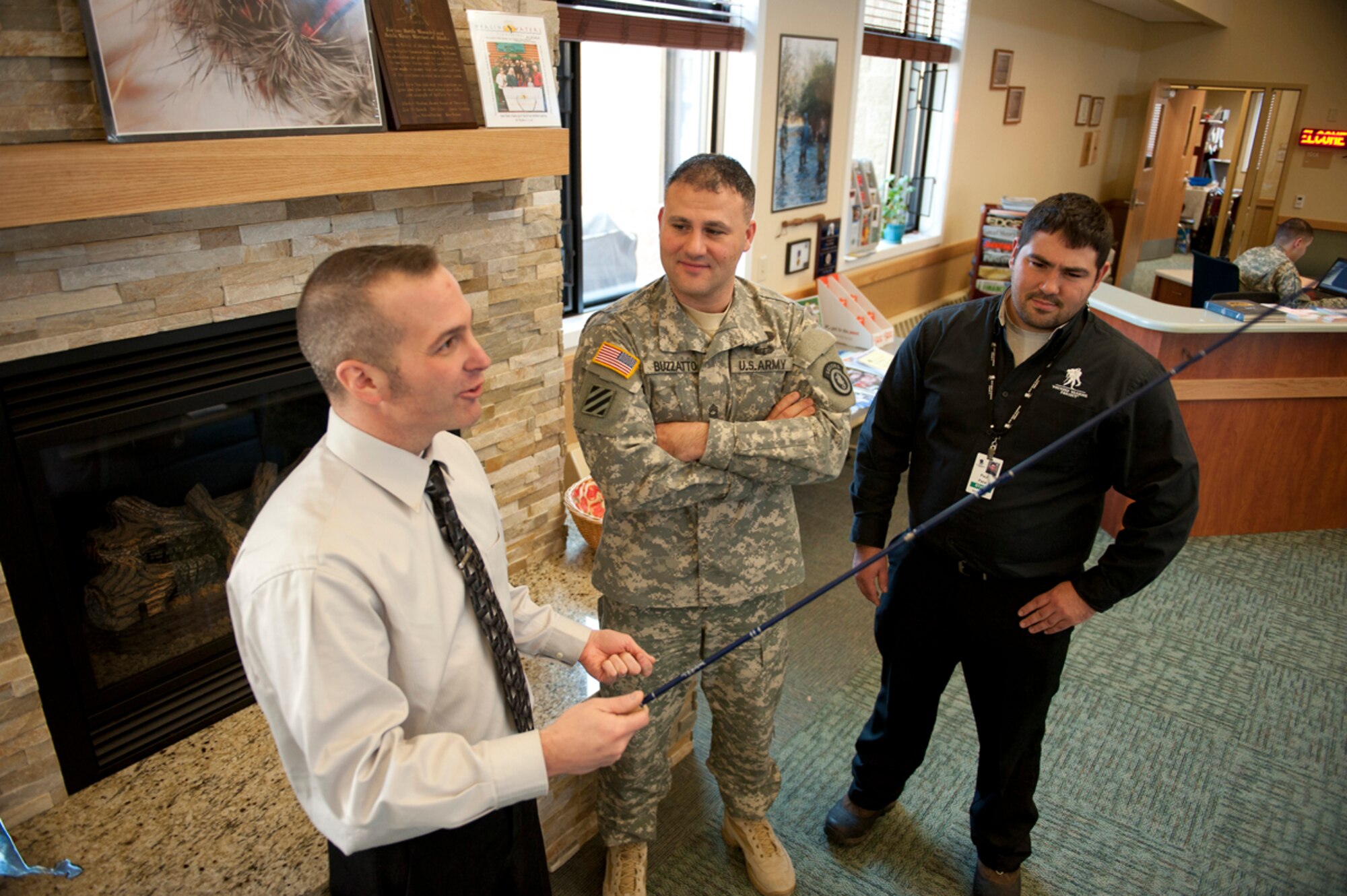 Christian Garrett, left, Army Master Sgt. Charles Buzzatto, center, and Paul Pace, right, discuss how fly fishing can help wounded warriors regain confidence and transition towards their next step in the Warrior Transition Battalion - Alaska Nov. 6. WTB - Alaska recently networked with Warrior Transition Battalion - Hawaii so that the wounded warriors could use the recreation unique to Alaska, and an additional trip will take wounded warriors from Alaska to Hawaii. Garrett is a life skills coach for the Warrior Transition Battallion. Buzzatto is the Soldiers Family Assistance Center Army Liaison. Pace is a the Warrior Outreach Coordinator Northwest for the Wounded Warrior Program. (U.S. Air Force photo/Staff Sgt. Robert Barnett)