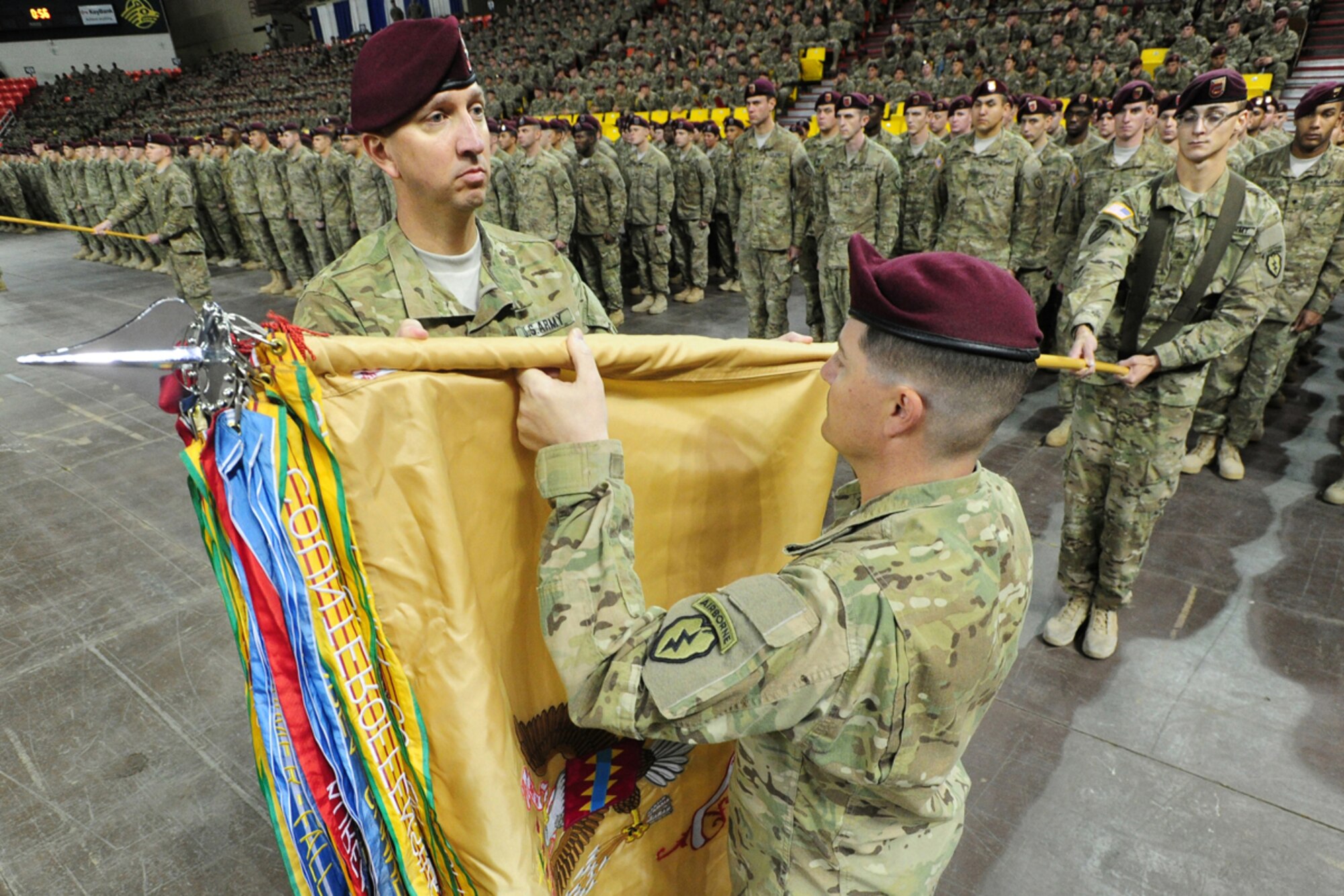 JOINT BASE ELMENDORF-RICHARDSON, Alaska -- U.S. Army Lt. Col. John Hinson, commander of 725th Brigade Support Battalion, left, and Command Sgt. Maj. Brian Morrison uncase their battalion's colors in front of paratroopers of U.S. Army Alaska's 4th Brigade Combat Team (Airborne), 25th Infantry Division, their families and distinguished guests gathered at the Sullivan Arena in Anchorage, Thursday, Nov. 1, 2012, for a redeploymentceremony to formally welcome the brigade home from a 10-month deployment to Afghanistan's Paktya and Khowst provinces in support of Operation Enduring Freedom XII-XIII.  During the deployment eight of Task Force Spartan's Soldiers were killed-in-action.  (U.S. Air Force photo by Justin Connaher)
