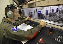 Tech. Sgt. David Burns, 359th Aerospace Medicine Squadron aerospace and operational physiology instructor, teaches an aircrew fundamentals course inside the hypobaric chamber to students from the 344th Training Squadron, JBSA-Lackland Oct. 25 at Joint Base San Antonio-Randolph. (U.S. Air Force photo by Benjamin Faske)