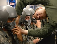 Airman 1st Class Alston O'Hara, 359th Aerospace Medicine Squadron aerospace and operational physiology instructor, conducts don and clearing drills during an oxygen lab with students from the 344th Training Squadron JBSA-Lackland, Oct.25 at Joint Base San Antonio-Randolph. (U.S. Air Force photo by Benjamin Faske)