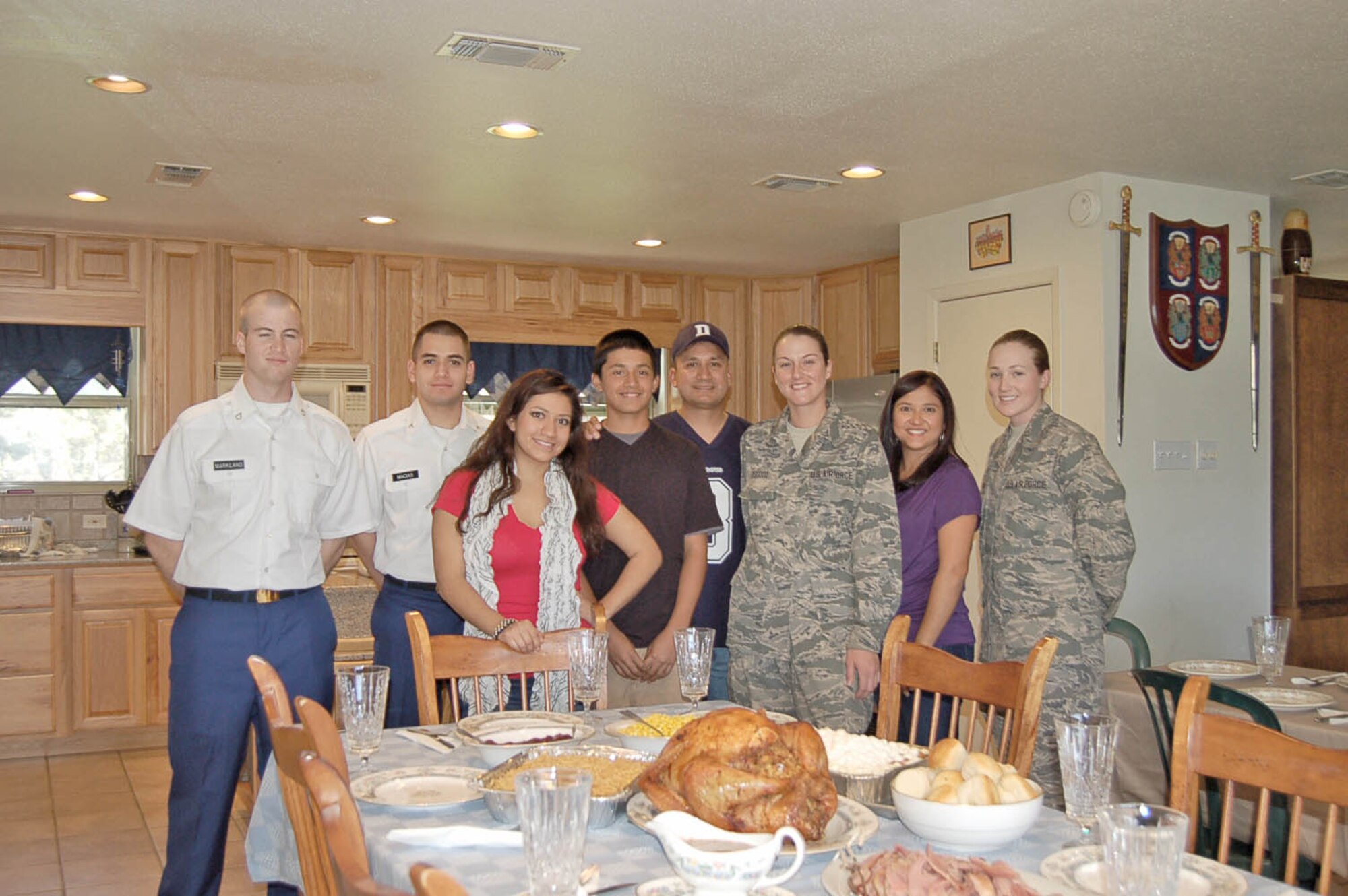 Chief Master Sgt. Jose Lopez, headquarters Air Education and Training Command Propulsion Chief, Directorate of Logistics, Installations and Mission Support, and his family, hosted two Air Force basic trainees from Lackland and two Soldiers from Fort Sam Houston for Operation Homecoming in 2011. From left to right are: Army combat medics Pfc. Benjamin Markland and Pfc. Albert Macias, daughter Saleena, son Cory, Chief Lopez, AB Brittany Osgood, wife Debra, and AB Allie Skallerud. (Courtesy Photo)