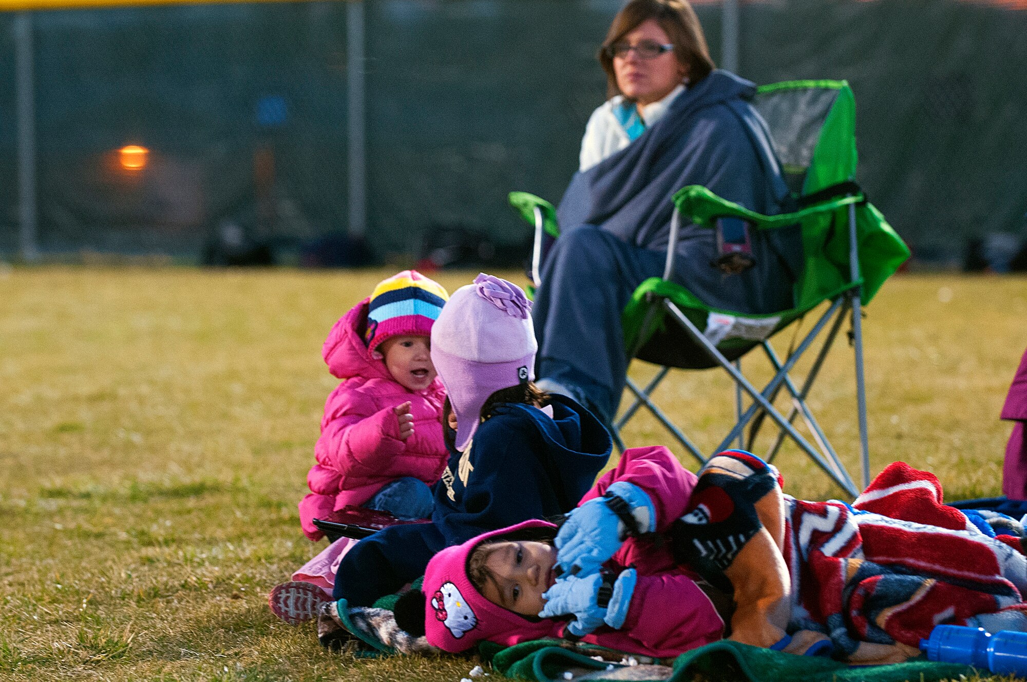 Fans of the 90th Security Forces Group Tactical Response Force flag football team stay warm on the sidelines of the F. E. Warren flag football championship games Nov. 2. Their attendance paid off as the 90th SFG/TRF won the title. (U.S. Air Force photo by R.J. Oriez)