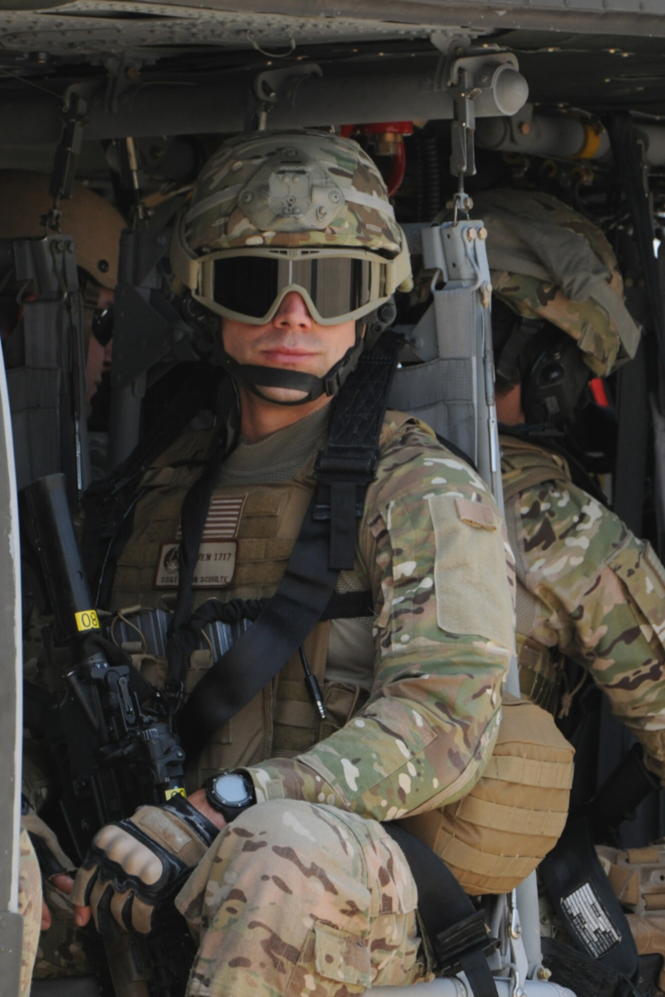 A Security Forces Airman preparing to deploy to Afghanistan waits on board a UH-60 Black Hawk helicopter at Joint Base McGuire-Dix-Lakehurst, N.J. while attending Security Forces pre-deployment training. The U.S. Air Force Expeditionary Center’s courses continued despite power outages lasting a week and no phone connectivity due to damages from Hurricane Sandy. Nearly 200 students graduated from EC courses this week.  (U.S. Air Force photo by Tech. Sgt. Zachary Wilson/Released.)  