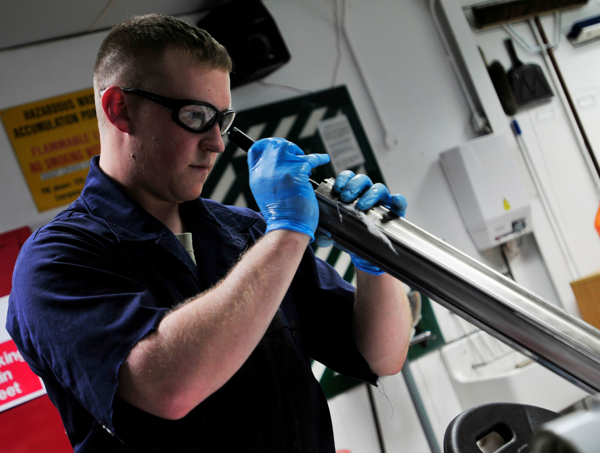 ROYAL AIR FORCE LAKENHEATH, England - Staff Sgt. Christopher Waller, 48th Component Maintenance Squadron hydraulic systems craftsman and a Bunceton, Mo. native, cleans and inspects an F-15 E model nose landing gear strut in the hydraulics shop Nov. 8, 2012. Hydraulics, fuels, electro environmental and emergency global rescue, escape and survival systems are the four sections that make up the accessories flight. They are responsible for intermediate level maintenance on the components of the F-15s. (U.S. Air Force photo by Senior Airman Tiffany M. Grigg) 