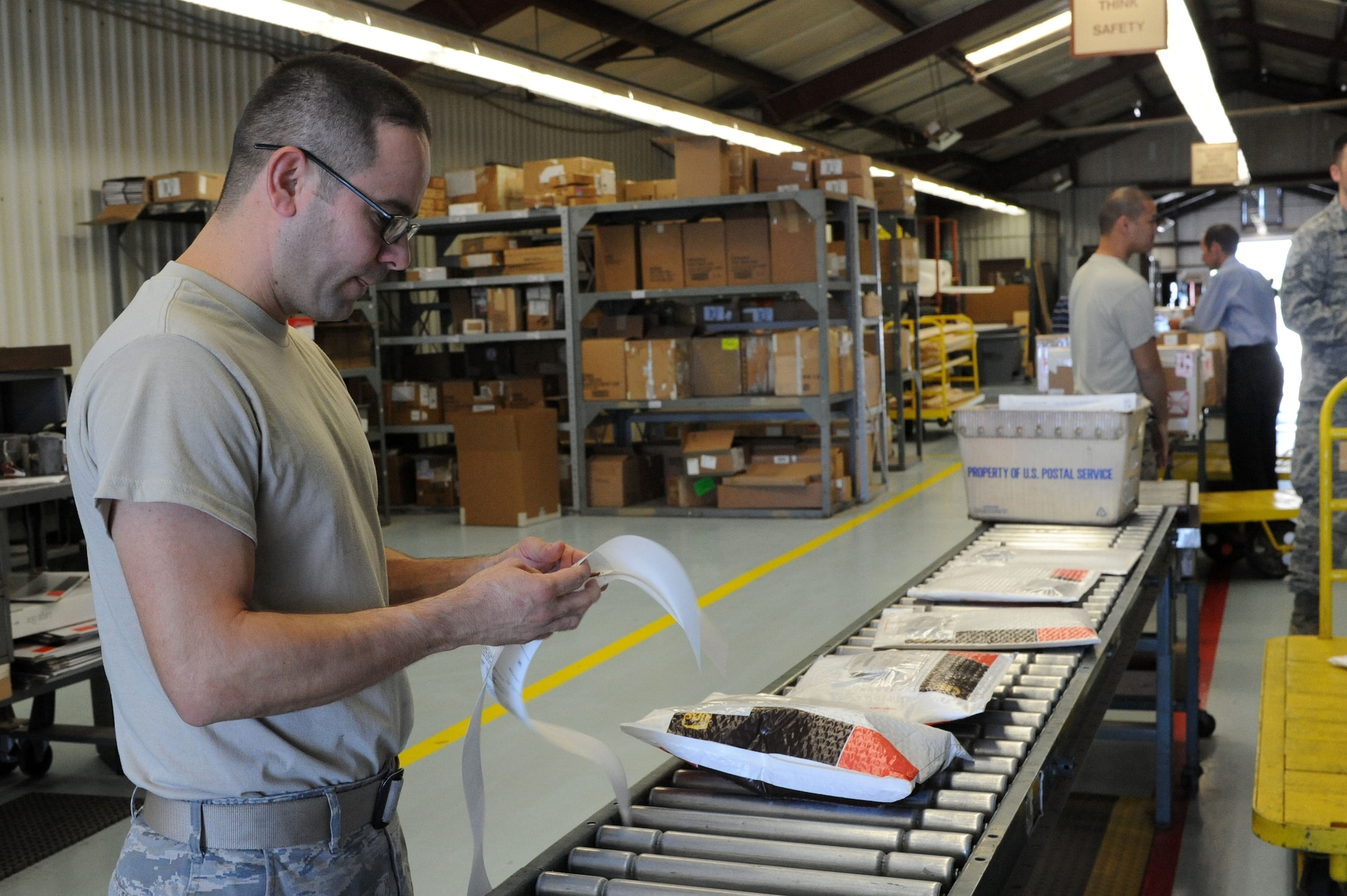 Staff Sgt. Ramon Nuno, 56th Logistics Readiness Squadron traffic management journeyman, checks the list of packages scheduled to be shipped at the Luke Air Force Base Traffic Management Office Oct. 19. The 56th LRS TMO handles shipment of military equipment and various items such as ammunition, documents and vehicles. (U.S. Air Force photo by Airman 1st Class Devante Williams)