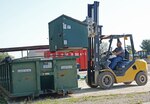 Jose Carlos Mireles, contract recycle technician, uses a forklift to unload a recycle receptacle Nov. 5 at Joint Base San Antonio-Randolph.  (U.S. Air Force photo by Benjamin Faske)