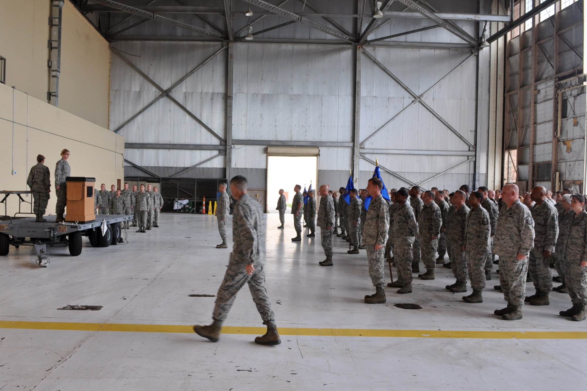 Lt. Col. Kenneth Rose, commander, 307th Maintenance Group, walks to the stage during commander’s call in Hangar One at Barksdale Air Force Base, La., Nov. 4, 2012. This was the first commander’s call held in the hangar since its remodeling. (U.S. Air Force photo by Master Sgt. Jeff Walston/ Released)