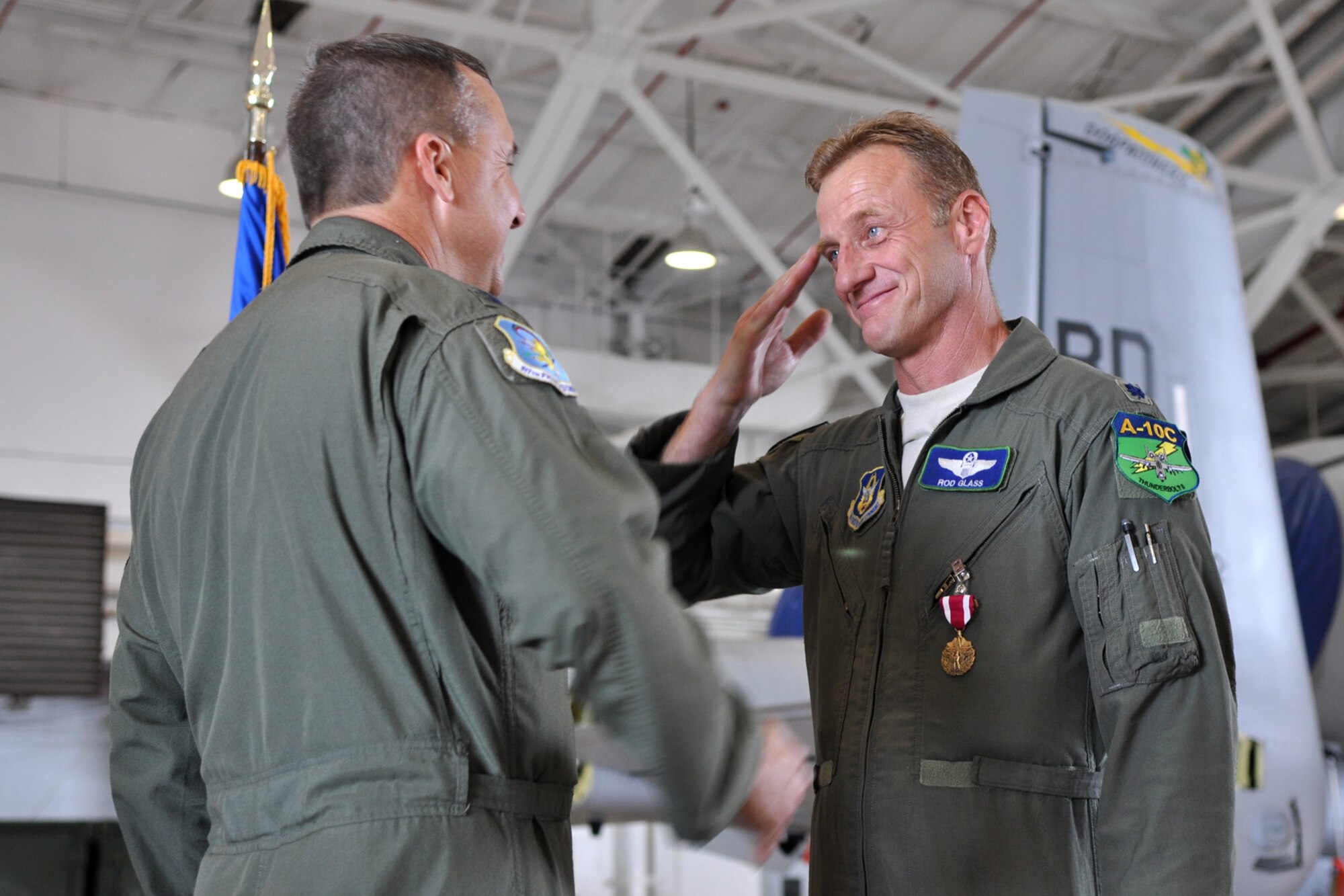 U.S. Air Force Lt. Col. Rodney Glass, the 917th Fighter Group deputy commander, salutes Col. John Breazeale, commander, 917th FG, after being awarded the Meritorious Service Medal at Barksdale Air Force Base, La., Nov. 3, 2012. Glass, who has more than 4,000 flying hours, was retiring after 28 years of service to his country. (U.S. Air Force photo by Master Sgt. Jeff Walston/Released)