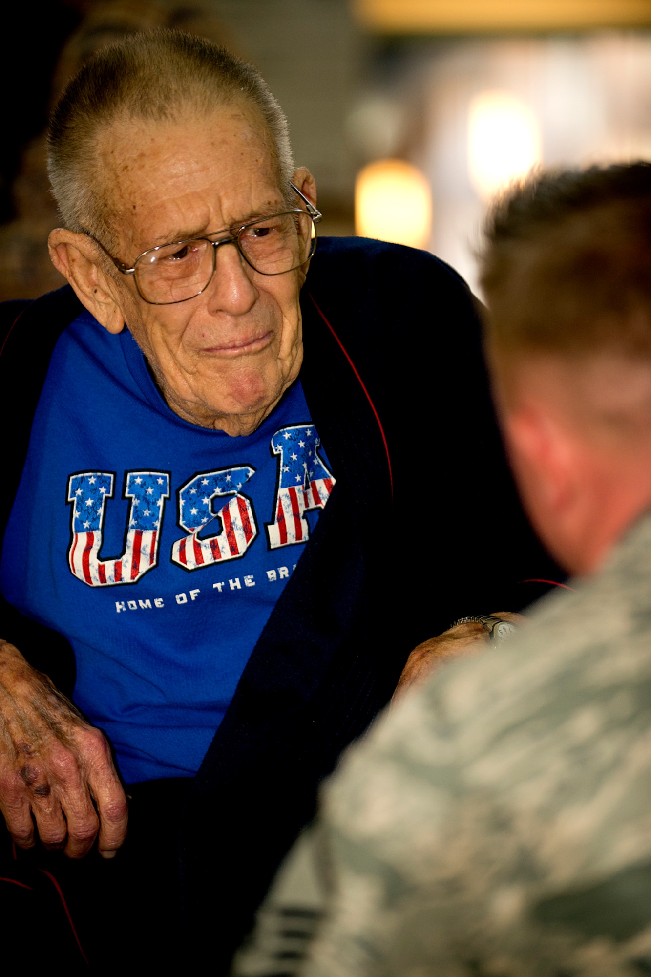 Stephen Ward, a Korean War veteran and resident of the Northwest Louisiana War Veterans Home, becomes emotional while talking to U.S. Air Force Master Sgt. Steve Wilson, Nov. 6, 2012, Bossier City, La. Wilson is a member of the U.S. Air Force Band of the West and his ensemble performed at the veterans home in addition to supporting the Global Strike Challenge score posting held on Barksdale Air Force Base, La. (U.S. Air Force photo by Master Sgt. Greg Steele/Released)
