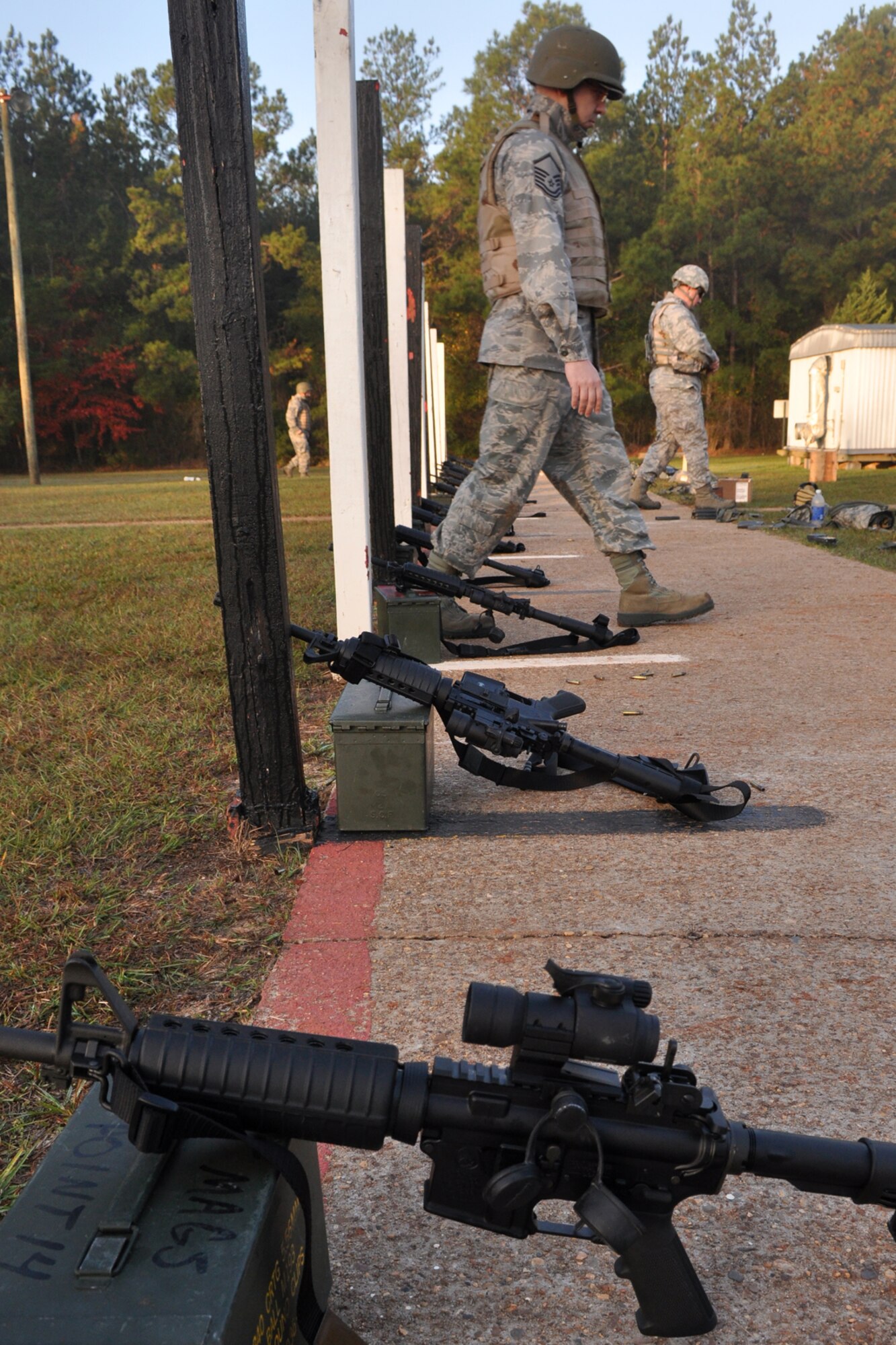 Airmen from the 307th Civil Engineer Squadron return to the firing line after checking their targets at a range near Barksdale Air Force Base, La., Nov. 3, 2012. (U.S. Air Force photo by Master Sgt. Jeff Walston/Released) 