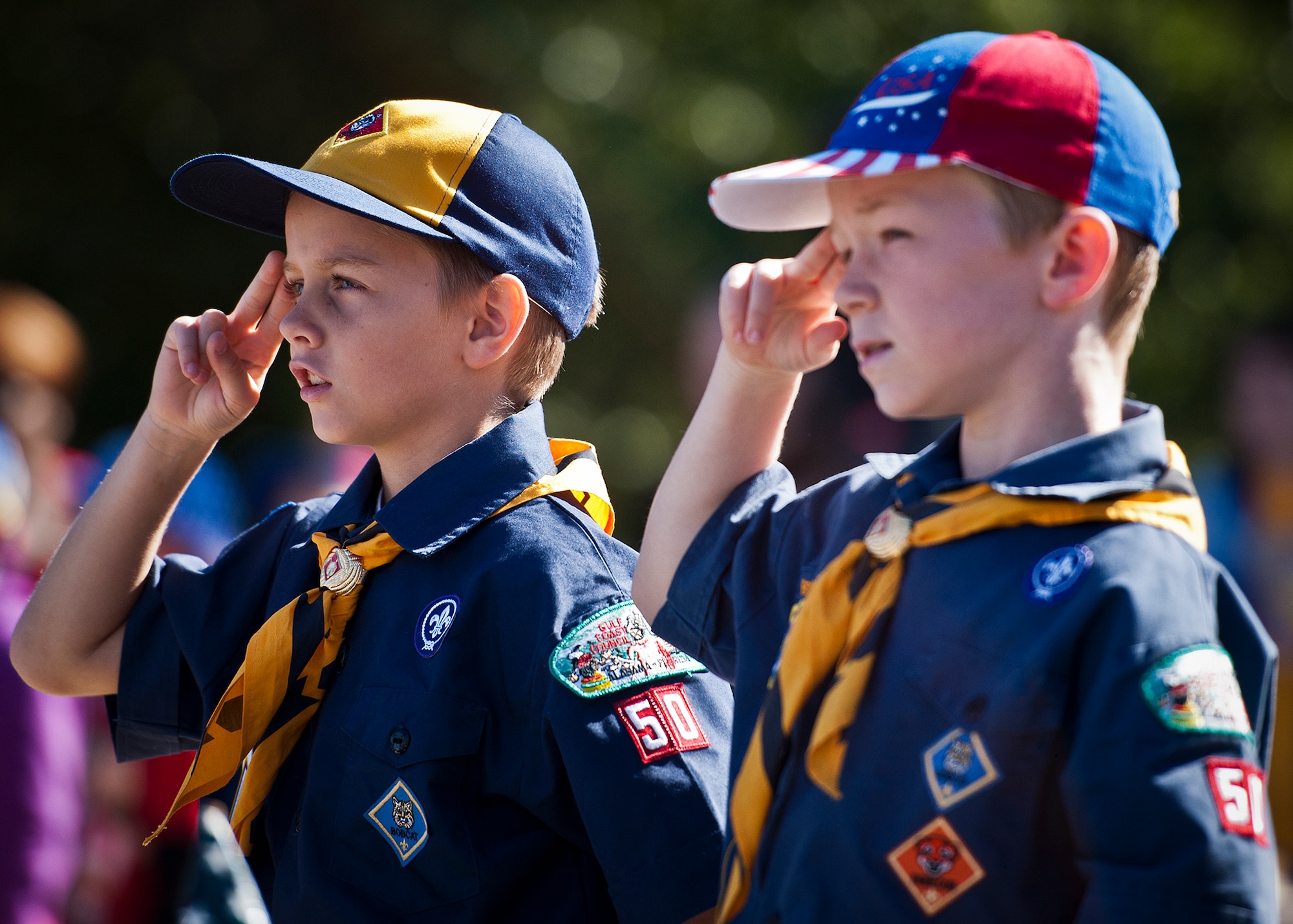 Cub Scouts from Eglin Elementary School salute the flag during the National Anthem at the school’s Veterans Day ceremony at the All Wars Memorial at Eglin Air Force Base, Fla., Nov. 8. More than 400 students attended the ceremony.  (U.S. Air Force photo/Samuel King Jr.