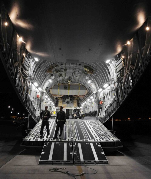 The interior of a C-17 Globemaster III can be seen shortly before Airmen from the 154th and 15th Wings performed a "live load" on the aircraft Nov. 9 during an exercise at Joint Base Pearl Harbor-Hickam, Hawaii. As part of a Phase I deployment exercise, the live load  simulated one step in a deployment process designed to rapidly deploy Airmen in response to worldwide contingency operations. (U.S. Air Force photo by Staff Sgt. Nathan Allen)