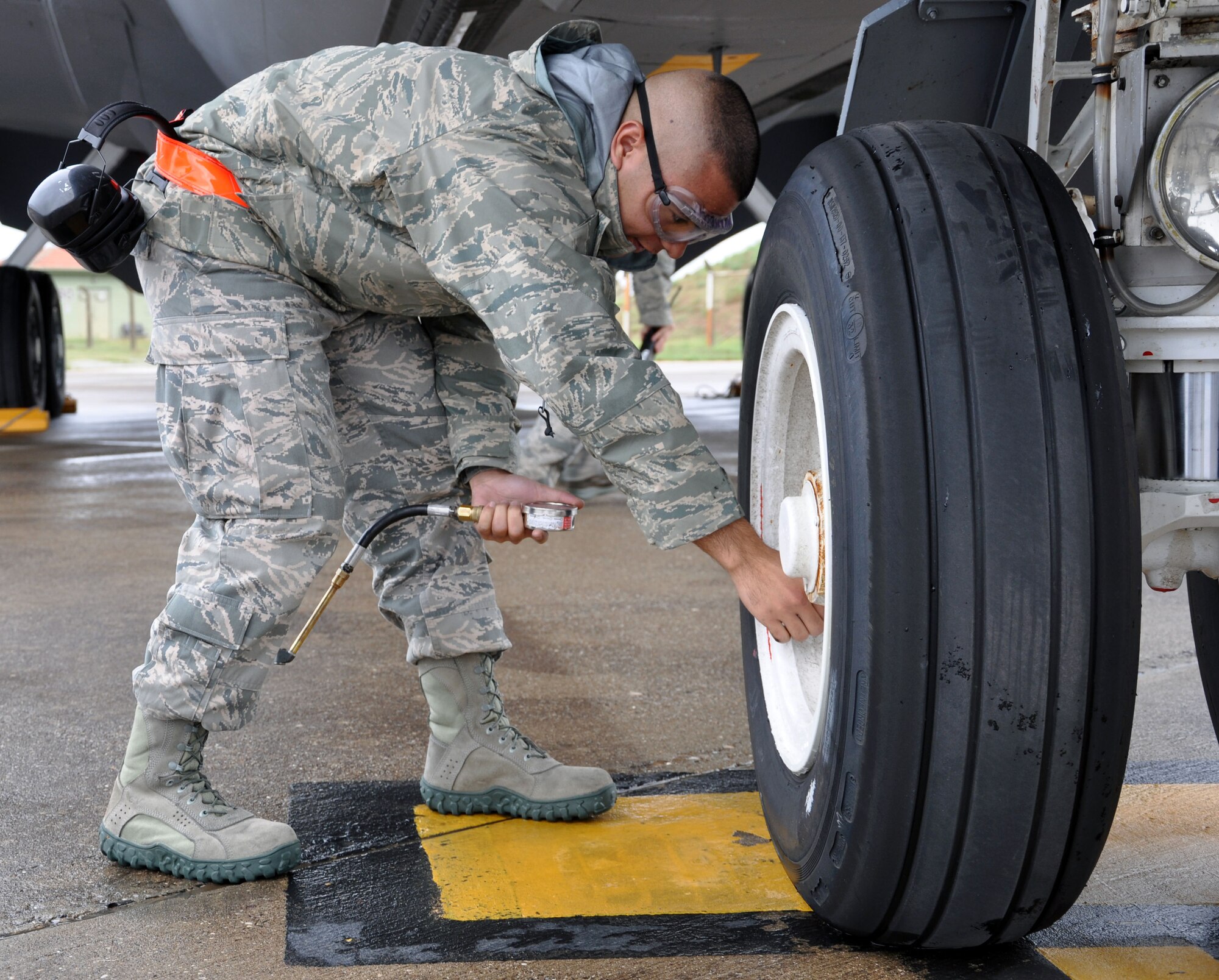 Senior Airman Matthew Potter, a crew chief assigned to the 90th Expeditionary Air Refuling Squadron, checks the pressure on the tires of a KC-135 Stratotanker on the flightline at Incirlik Air Base, Turkey, during pre-flight checks on the aircraft, Nov. 9, 2012.  Aircraft maintainers perform a long list of checks on the tankers prior to each flight to ensure all systems on the aircraft are operating properly.  Potter is an Air Force Reservist from the 931st Air Refueling Group, McConnell Air Force Base, Kan.  (U.S. Air Force photo by 1st Lt. Zach Anderson)