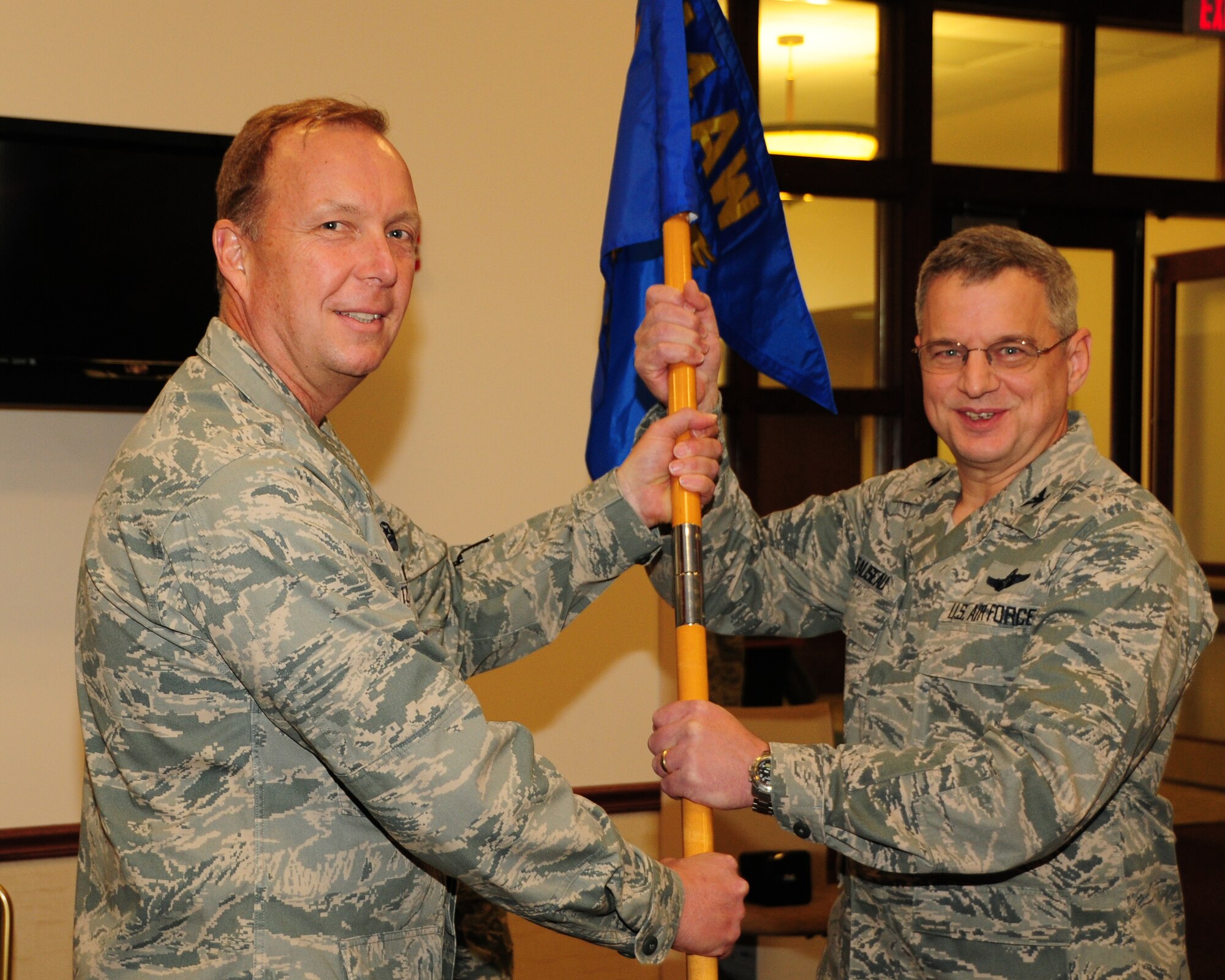 Col. Alan C. Teauseau (right) accepts the group guidon as the new 914th Mission Support Group Commander from Col. Allan Swartzmiller, 914th Airlift Wing Commander during an assumption of command ceremony on November 3, 2012 at the Niagara Falls Air Reserve Station, N.Y. The new commander brings with him a vast amount of experience as the mission support group commander from Whiteman AFB, Missouri. (U.S. Air Force photo by Peter Borys).