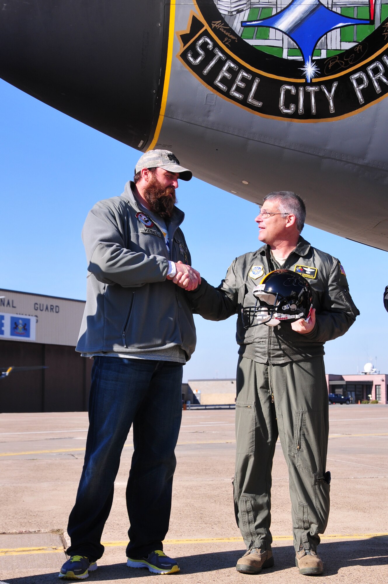 Four players from the Pittsburgh Steelers: Jonathan Dwyer, James Harrison, Brett Keisel and Doug Legursky visit the 171st Air Refueling Wing, November 6.  The visit, part of the "Salute to Service" campaign, is sponsored by the NFL in conjunction with USAA.  The NFL is also paying tribute to the Armed Forces throughout the month of November.  During the visit, the players take time to autograph one of the unit's KC-135 aircraft, Steel City Pride.
	
The Salute to Service campaign aligns with the NFL's long history of supporting America's armed services, including a partnership of more than 45 years with the USO that includes overseas visits to troops and trips to military hospitals nationwide. 

During the Pittsburgh Steelers' November 12 game, the Steelers will honor a veteran from every war, and recognize a local Harrier pilot who was shot down and killed last month over Afghanistan. The Steelers will also recognize their local military community by paying tribute to the service men and women of the 171st Air Refueling Wing. The team is partnering with USAA for a stadium-wide card stunt that features a special military appreciation message during the National Anthem. Fans will be instructed to hold up the card at their seats just before the National Anthem. 

(National Guard photo by Master Sgt. Ann Young/released)

