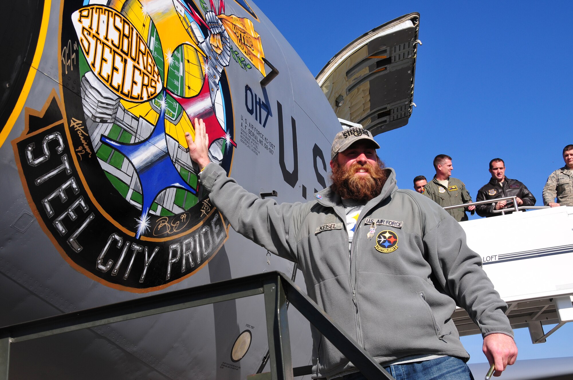 Four players from the Pittsburgh Steelers: Jonathan Dwyer, James Harrison, Brett Keisel and Doug Legursky visit the 171st Air Refueling Wing, November 6.  The visit, part of the "Salute to Service" campaign, is sponsored by the NFL in conjunction with USAA.  The NFL is also paying tribute to the Armed Forces throughout the month of November.  During the visit, the players take time to autograph one of the unit's KC-135 aircraft, Steel City Pride.
	
The Salute to Service campaign aligns with the NFL's long history of supporting America's armed services, including a partnership of more than 45 years with the USO that includes overseas visits to troops and trips to military hospitals nationwide. 

During the Pittsburgh Steelers' November 12 game, the Steelers will honor a veteran from every war, and recognize a local Harrier pilot who was shot down and killed last month over Afghanistan. The Steelers will also recognize their local military community by paying tribute to the service men and women of the 171st Air Refueling Wing. The team is partnering with USAA for a stadium-wide card stunt that features a special military appreciation message during the National Anthem. Fans will be instructed to hold up the card at their seats just before the National Anthem. 

(National Guard photo by Master Sgt. Ann Young/released)
