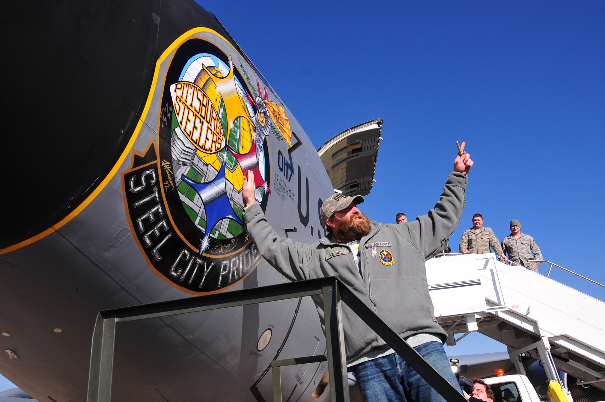 Four players from the Pittsburgh Steelers: Jonathan Dwyer, James Harrison, Brett Keisel and Doug Legursky visit the 171st Air Refueling Wing, November 6.  The visit, part of the "Salute to Service" campaign, is sponsored by the NFL in conjunction with USAA.  The NFL is also paying tribute to the Armed Forces throughout the month of November.  During the visit, the players take time to autograph one of the unit's KC-135 aircraft, Steel City Pride.
	
The Salute to Service campaign aligns with the NFL's long history of supporting America's armed services, including a partnership of more than 45 years with the USO that includes overseas visits to troops and trips to military hospitals nationwide. 

During the Pittsburgh Steelers' November 12 game, the Steelers will honor a veteran from every war, and recognize a local Harrier pilot who was shot down and killed last month over Afghanistan. The Steelers will also recognize their local military community by paying tribute to the service men and women of the 171st Air Refueling Wing. The team is partnering with USAA for a stadium-wide card stunt that features a special military appreciation message during the National Anthem. Fans will be instructed to hold up the card at their seats just before the National Anthem. 

(National Guard photo by Master Sgt. Ann Young/released)
