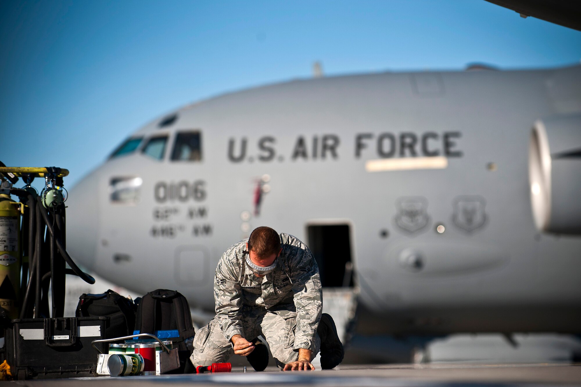 Airman 1st Class Charles Melendez inspects engine panel screws at the Transit Center at Manas, Kyrgyzstan, Nov. 8, 2012. Crew chiefs are responsible for the maintenance of the aircraft and support equipment. Melendez is a 376th Expeditionary Aircraft Maintenance Squadron crew chief who is deployed from Fairchild Air Force Base, Wash., and a native of San Juan, Puerto Rico. (U.S. Air Force photo/Senior Airman Brett Clashman)