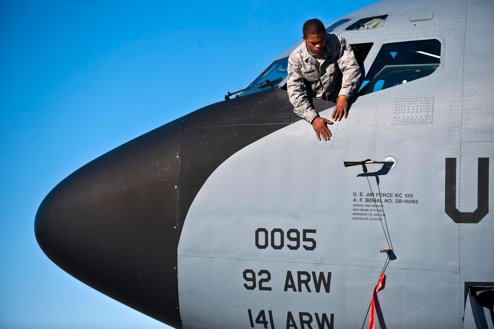 Airman 1st Class Monquavious Johnson inspects the fuselage of a KC-135 Stratotanker at the Transit Center at Manas, Kyrgyzstan, Nov. 8, 2012. Crew chiefs inspect the external part of the aircraft for structural damage. Johnson is a 376th Expeditionary Aircraft Maintenance Squadron crew chief who is deployed from MacDill Air Force Base, Fla., and a native of Atlanta. (U.S. Air Force photo/Senior Airman Brett Clashman)