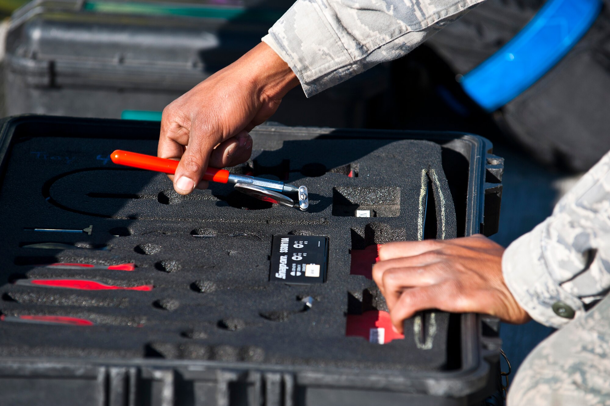 Airman 1st Class Monquavious Johnson selects a round pocket mirror during a routine maintenance check on a KC-135 Stratotanker at the Transit Center at Manas, Kyrgyzstan, Nov. 8, 2012. Crew chiefs are responsible for the maintenance of the aircraft and support equipment. Johnson is a 376th Expeditionary Aircraft Maintenance Squadron crew chief who is deployed from MacDill Air Force Base, Fla., and a native of Atlanta. (U.S. Air Force photo/Senior Airman Brett Clashman)