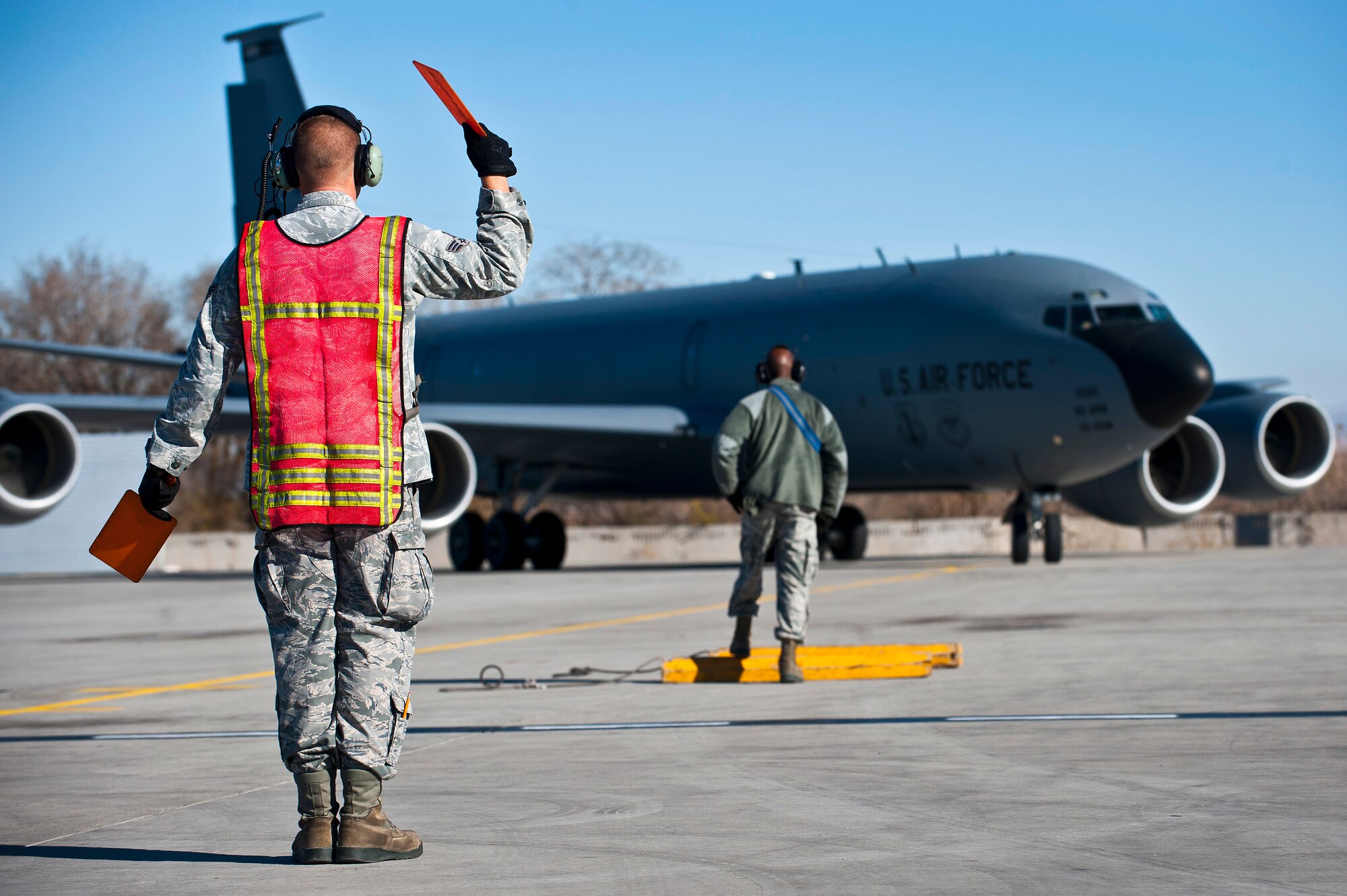 Senior Airman Cody Haynes marshals a KC-135 Stratotanker at the Transit Center at Manas, Kyrgyzstan, Nov. 8, 2012. Crew chiefs are responsible for the maintenance of the aircraft and support equipment. Haynes is a 376th Expeditionary Aircraft Maintenance Squadron crew chief who is deployed from Fairchild Air Force Base, Wash., and a native of Woodbridge, Va. (U.S. Air Force photo/Senior Airman Brett Clashman)