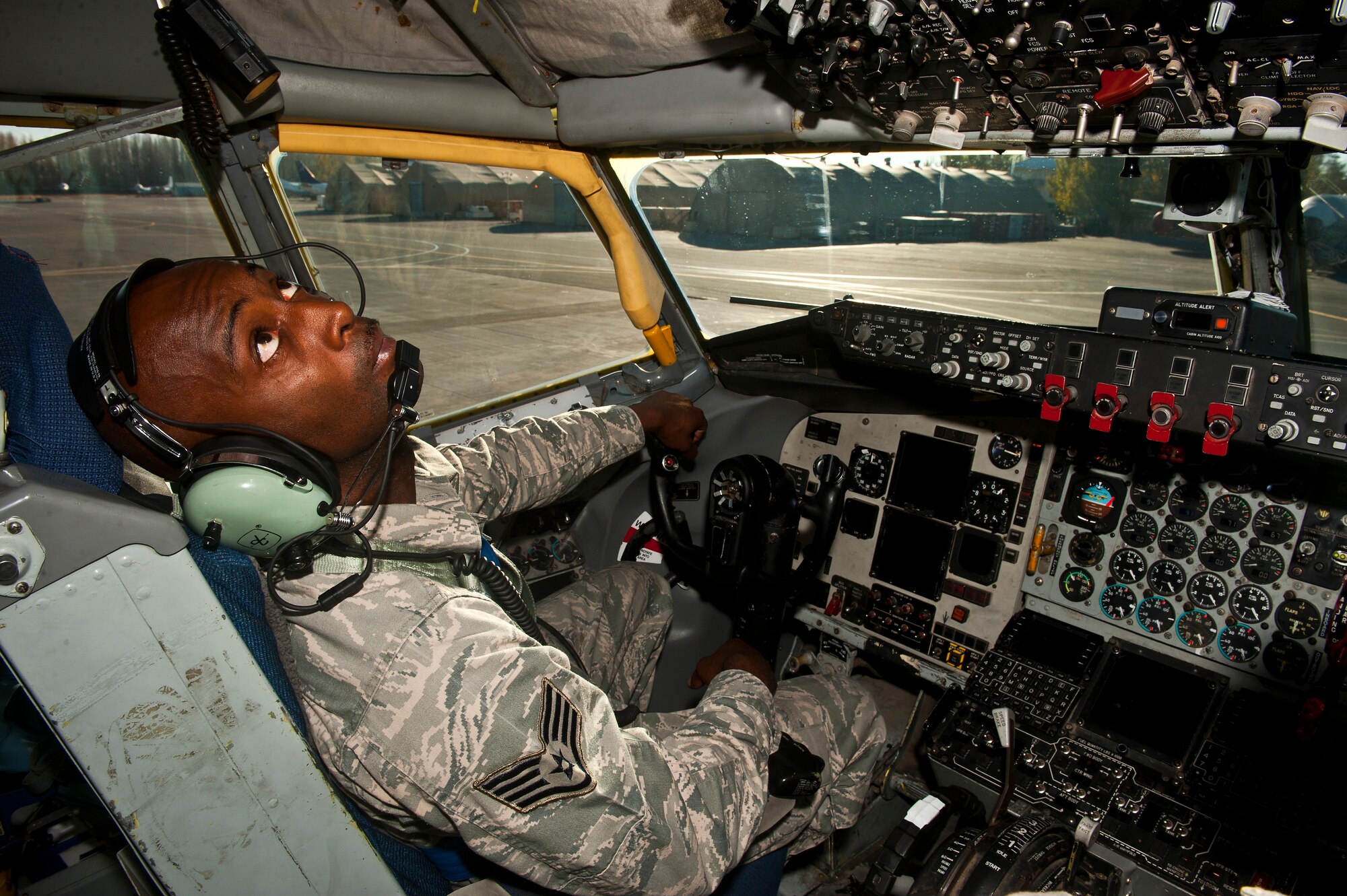 Staff Sgt. Carlos Mitchell conducts a pre-engine run check inside a KC-135 Stratotanker at the Transit Center at Manas, Kyrgyzstan, Nov. 8, 2012. Checks are conducted to identify any damage or leaks to the engines. Mitchell is a 376th Expeditionary Aircraft Maintenance Squadron crew chief who is deployed from McConnell Air Force Base, Kan., and a native of Columbia, S.C. (U.S. Air Force photo/Senior Airman Brett Clashman)