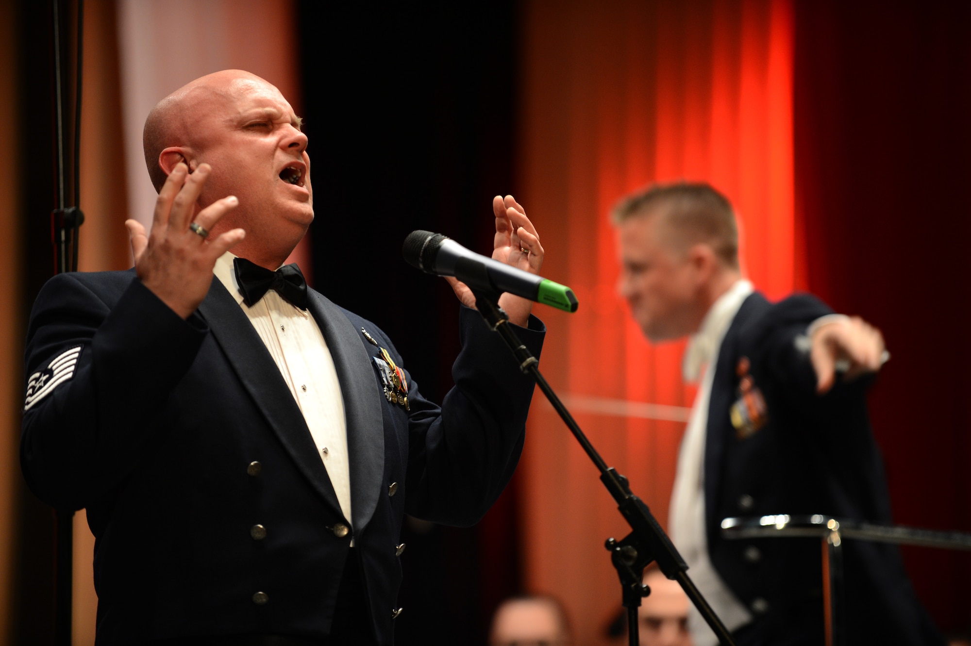 RADOM, Poland -- U.S. Air Force Tech. Sgt. Kenneth Maxwell, U.S. Air Forces in Europe Concert Band singer from Enon Valley, Pa., displays his vocal skills during a performance at the Radom City Hall concert hall Nov. 5, 2012.  The goal of the USAFE band is to strengthen diplomatic relationships with various countries around the world by sharing the American culture through music. (U.S. Air Force photo by Airman 1st Class Gustavo Castillo/Released) 