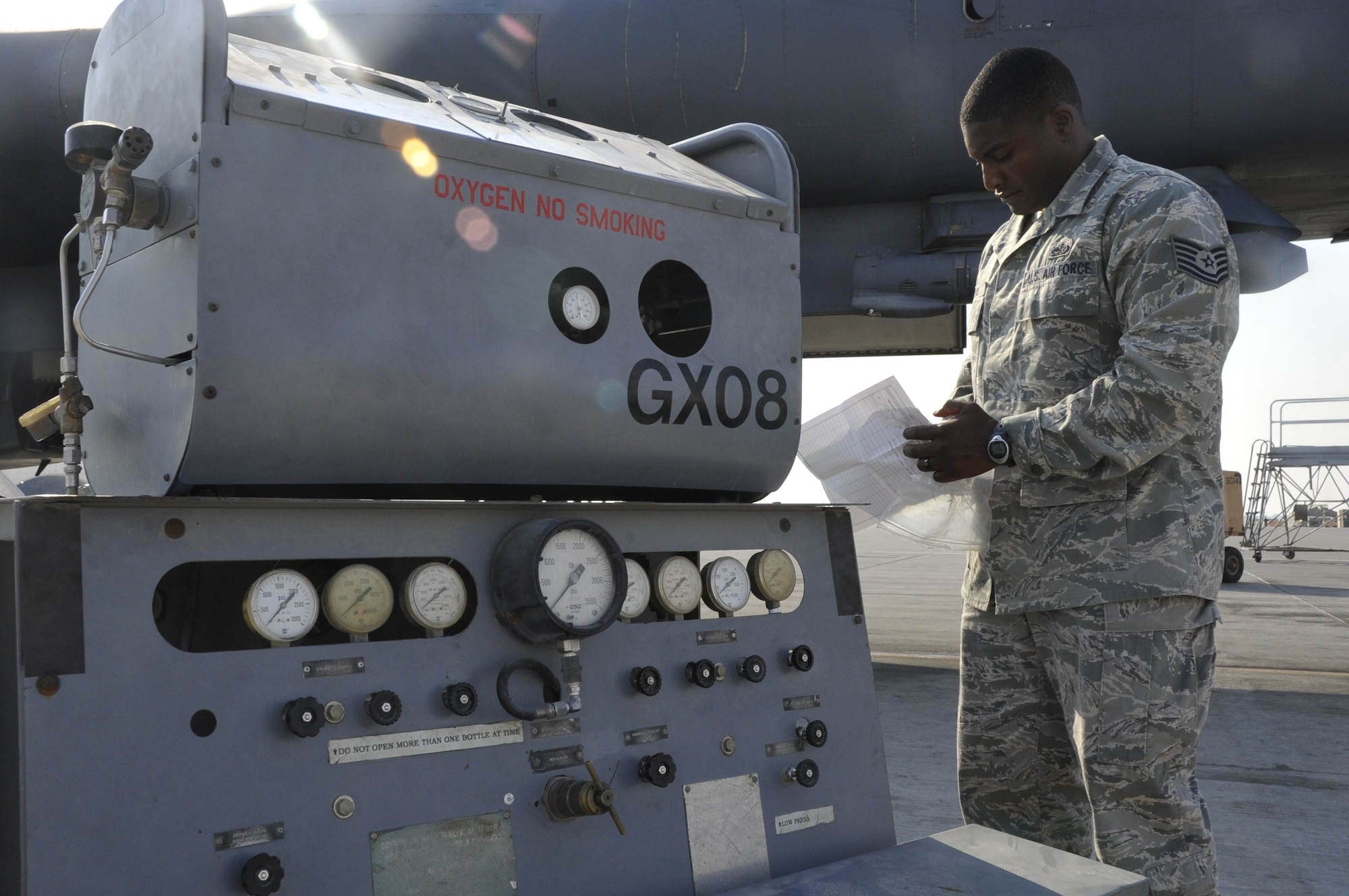 Tech. Sgt. Joseph Davis, 379th Expeditionary Maintenance Group Compliance Focus Team member, ensures a gaseous oxygen cart for a B-1 Lancer has proper documentation before its used Nov. 5, 2012. The Compliance Focus Team was developed to find the strengths and weaknesses of each unit's practices to improve the compliancy of the 379th EMXG with maintenance procedures and processes. (U.S. Air Force photo/Senior Airman Bryan Swink)