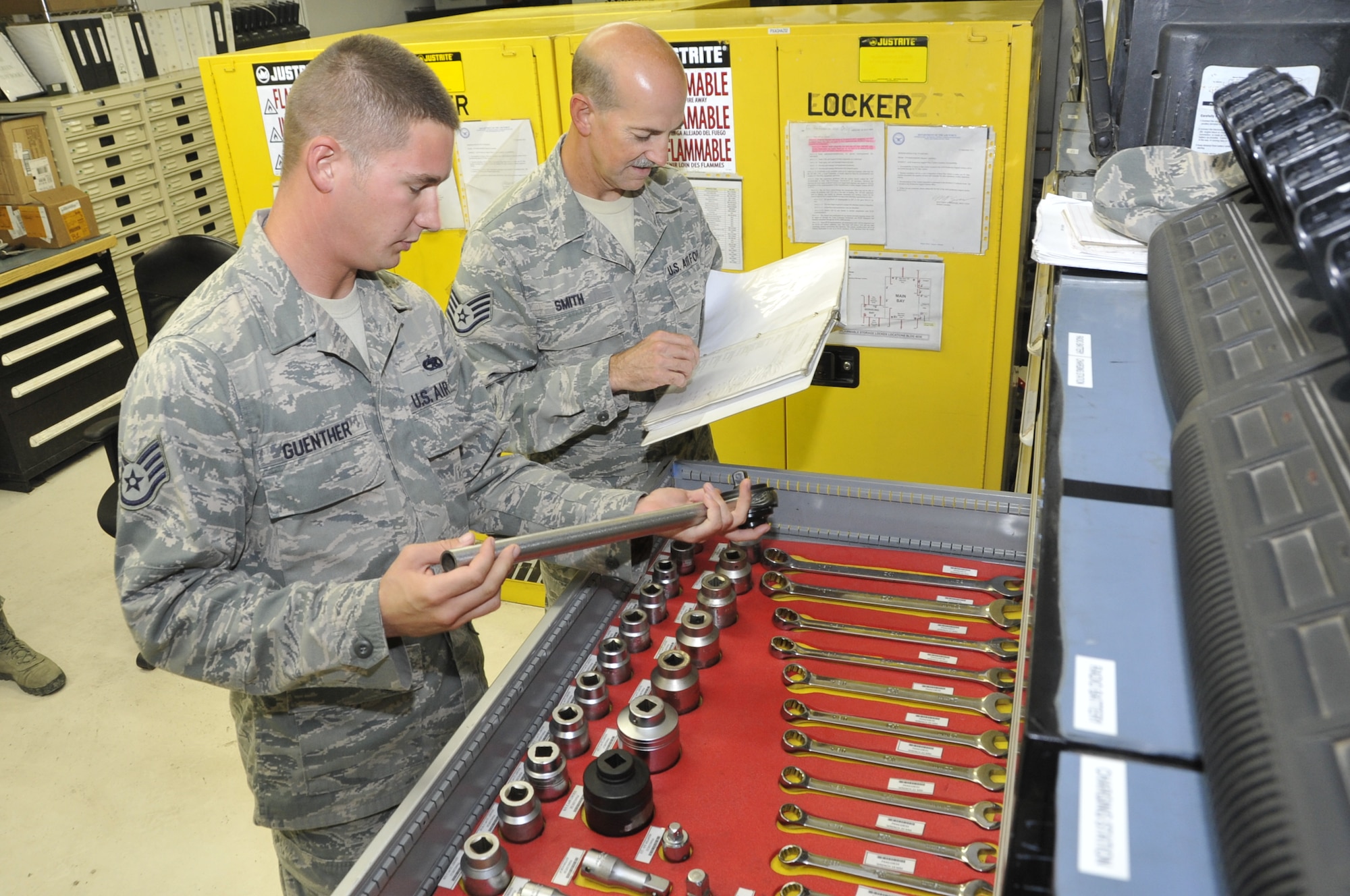 Staff Sgt. Jacob Guenther (left) and Staff Sgt. Michial Smith, 379th Expeditionary Maintenance Group Compliance Focus Team members, inspect tools in the 379th Aerospace Ground Equipment Flight for serviceability, corrosion and to ensure they have the correct identifier Nov. 5, 2012. The Compliance Focus Team was developed to find the strengths and weaknesses of each unit's practices to improve the compliancy of the 379th EMXG with maintenance procedures and processes. (U.S. Air Force photo/Senior Airman Bryan Swink)