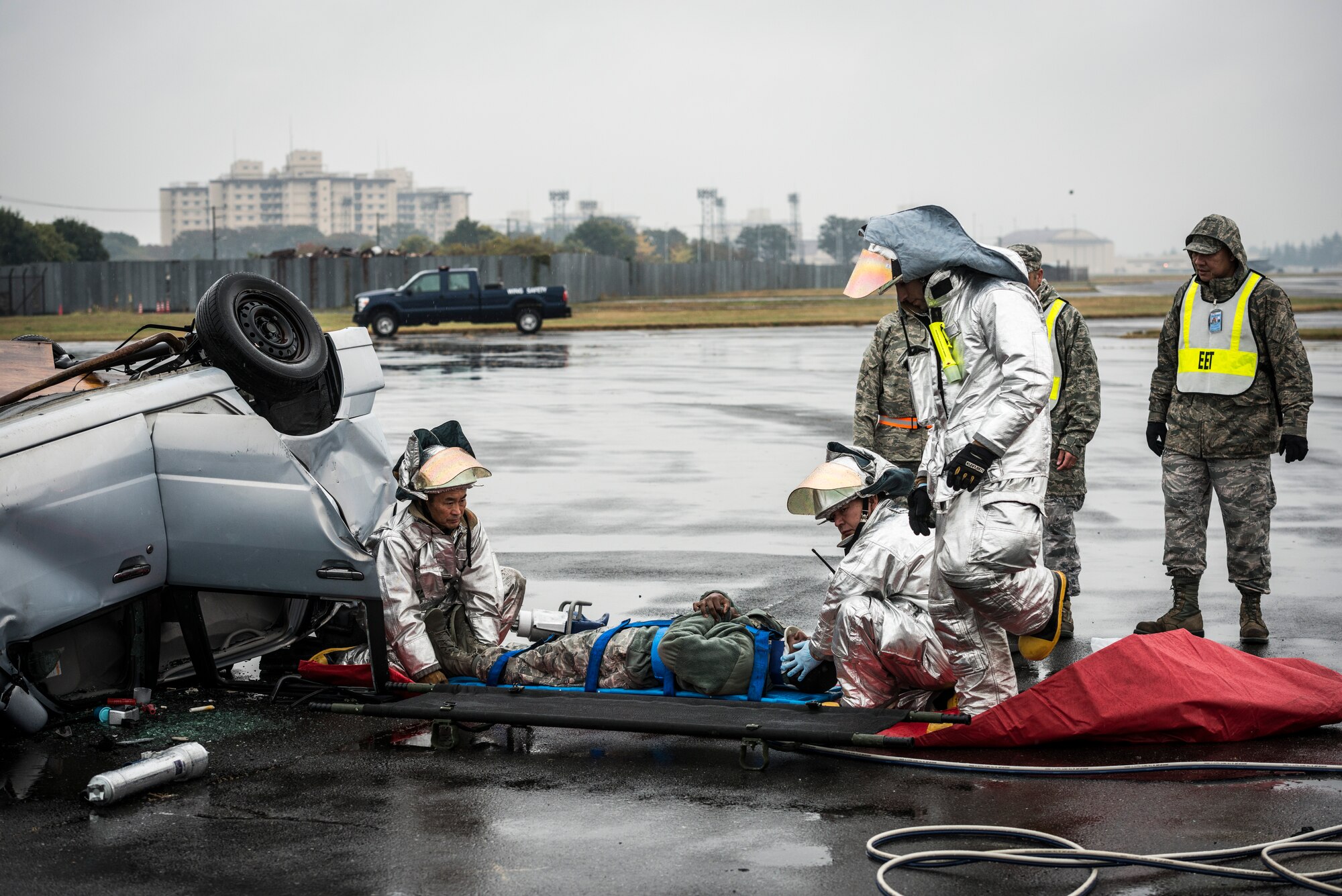 YOKOTA AIR BASE, Japan -- Firefighters with the 374th Civil Engineer Squadron rescue a simulated victim from a demolished car during an operational readiness exercise at Yokota Air Base, Japan, Nov. 6, 2012. Yokota's exercise evaluation team created a natural disaster scenario within the ORE to force the wing to handle multiple missions and emergencies at once. (U.S. Air Force photo by Tech. Sgt. Samuel Morse)