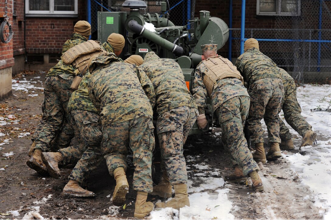 Marines push a large pump in Far Rockaway, N.Y., Nov. 8, 2012. The Marines pumped out the