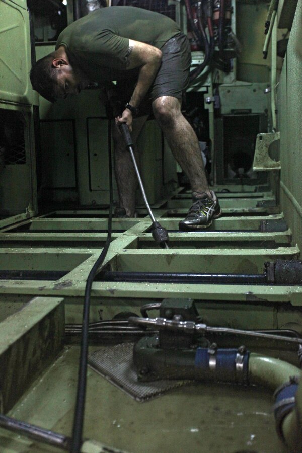 USS NEW YORK (Nov. 4, 2012) — A Marine with the 24th Marine Expeditionary Unit sprays the inside of an assault amphibious vehicle during wash down procedures aboard the USS New York, Nov. 4, 2012. Marines conducted the wash down inside the ship’s well deck to clean dirt and debris from their vehicles and equipment in preparation for their scheduled return to their home bases in North Carolina later this year. The 24th MEU is deployed with the Iwo Jima Amphibious Ready Group and is currently in the 6th Fleet Area of Responsibility as a disaster relief and crisis response force. Since deploying in March, they have supported a variety of missions in the U.S. Central and European Commands, assisted the Navy in safeguarding sea lanes, and conducted various bilateral and unilateral training events in several countries in the Middle East and Africa. (U.S. Marine Corps photo by Staff Sgt. Robert Fisher III/Released)