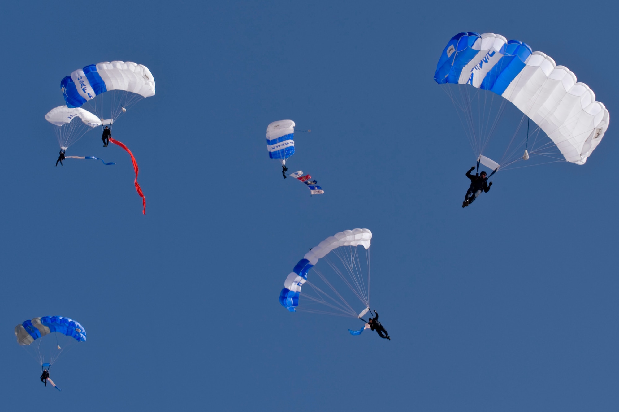 The U.S. Air Force Academy's Wings of Blue Parachute Team steer their parachutes for precision landings during Aviation Nation Nov.10, 2012, at Nellis Air Force Base, Nev.  The Wings of Blue team is based at the U.S. Air Force Academy in Colorado Springs, Colo. 
(U.S. Air Force photo by Staff Sgt. William P. Coleman) 
  

