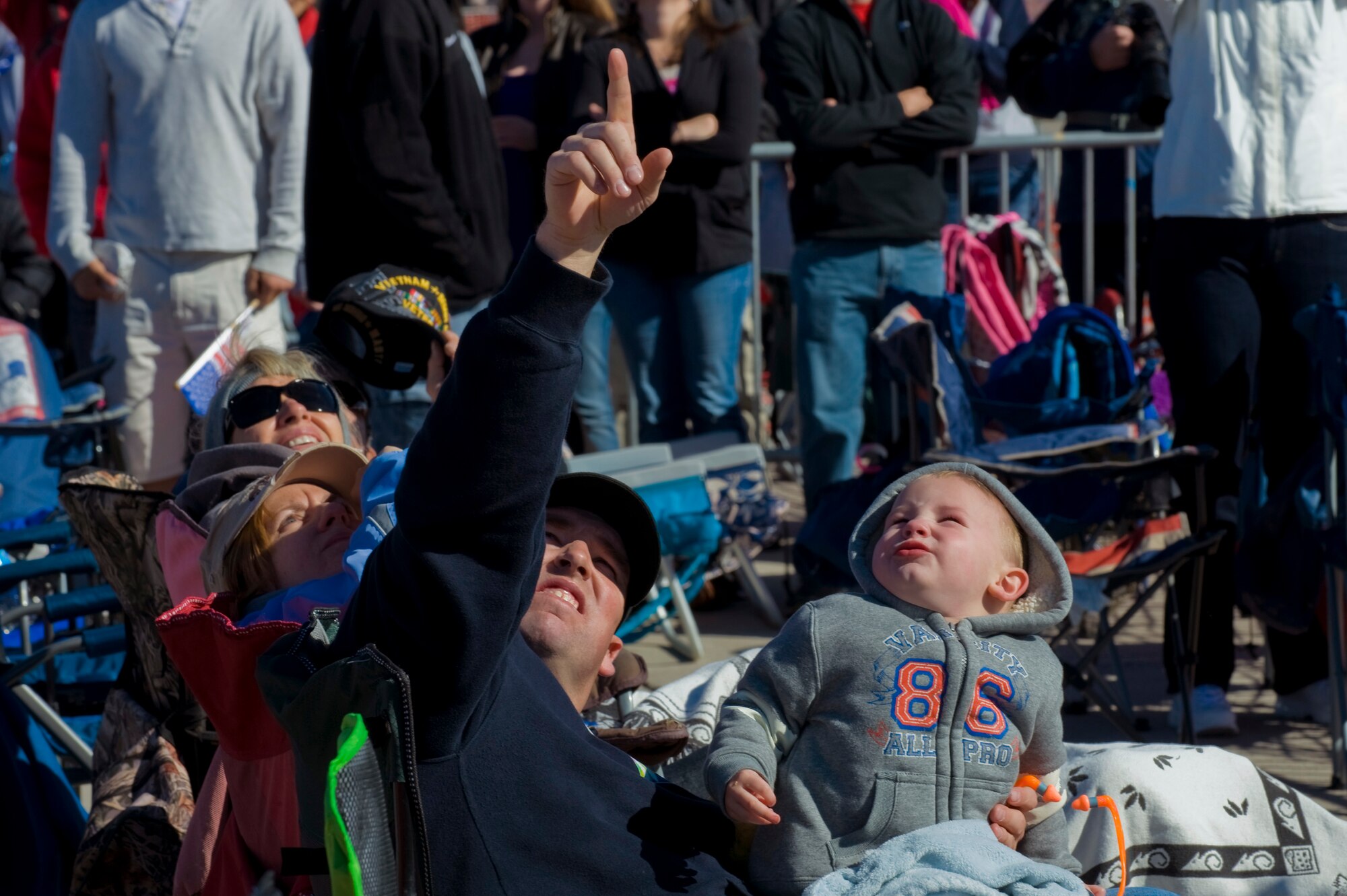 Aviation Nation spectators watch as the U.S. Air Force Academy's Wings of Blue Parachute Team freefalls Nov.10, 2012, at Nellis Air Force Base, Nev. The Wings of Blue demonstration team is composed of United States Air Force Academy cadet jumpers and 98th Flying Training Squadron staff members who perform globally on a regular basis. (U.S. Air Force photo by Staff Sgt. William P. Coleman) 
  

