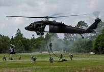 U.S. Army Rangers descend from a UH-60 Blackhawk to secure the area during a downed aircraft, hostile environment exercise at 6th Ranger Training Battalion’s Camp Rudder May 12.  Infiltration and exfiltration are only portions of the training potential Army Rangers experience during their final phase of training.  The entire course is 61 days in length and is divided into three phases. Each phase is conducted at different geographical and environmental locations.  (U.S. Air Force photo/Tech. Sgt. Samuel King Jr.)