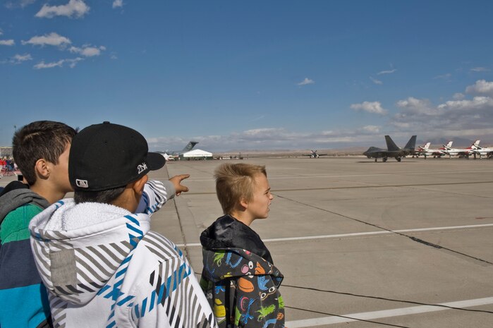 Students from the Innovations International Charter School of Nevada watch as the F-22 Raptor demo team prepares to take off during Aviation Nation Nov. 8, 2012, at Nellis Air Force Base, Nev. The students heard speeches from Airmen in different career fields and received a hands on tour of the flightline. (U.S. Air Force Photo by Senior Airman Daniel Hughes) 