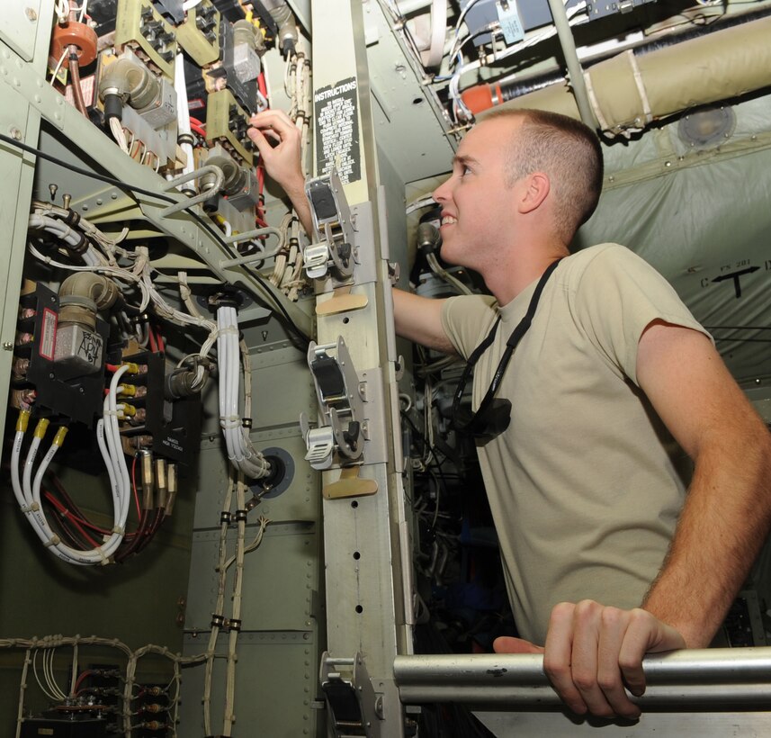 SOUTHWEST ASIA - Airman 1st Class Brandon Henry, 386th Expeditionary Aircraft Maintenance Squadron aircraft electrical and environmental system craftsman, trouble-shoots the panel on a C-130 Hercules before a scheduled mission. Henry determines the tools and parts required to fix whatever discrepancy arises as quickly as possible, while following all technical orders and proper documentation.  Henry is the 386th Air Expeditionary Wing Rock Solid Warrior this week. (U.S. Air Force photo/Staff Sgt. Alexandra M. Boutte) 