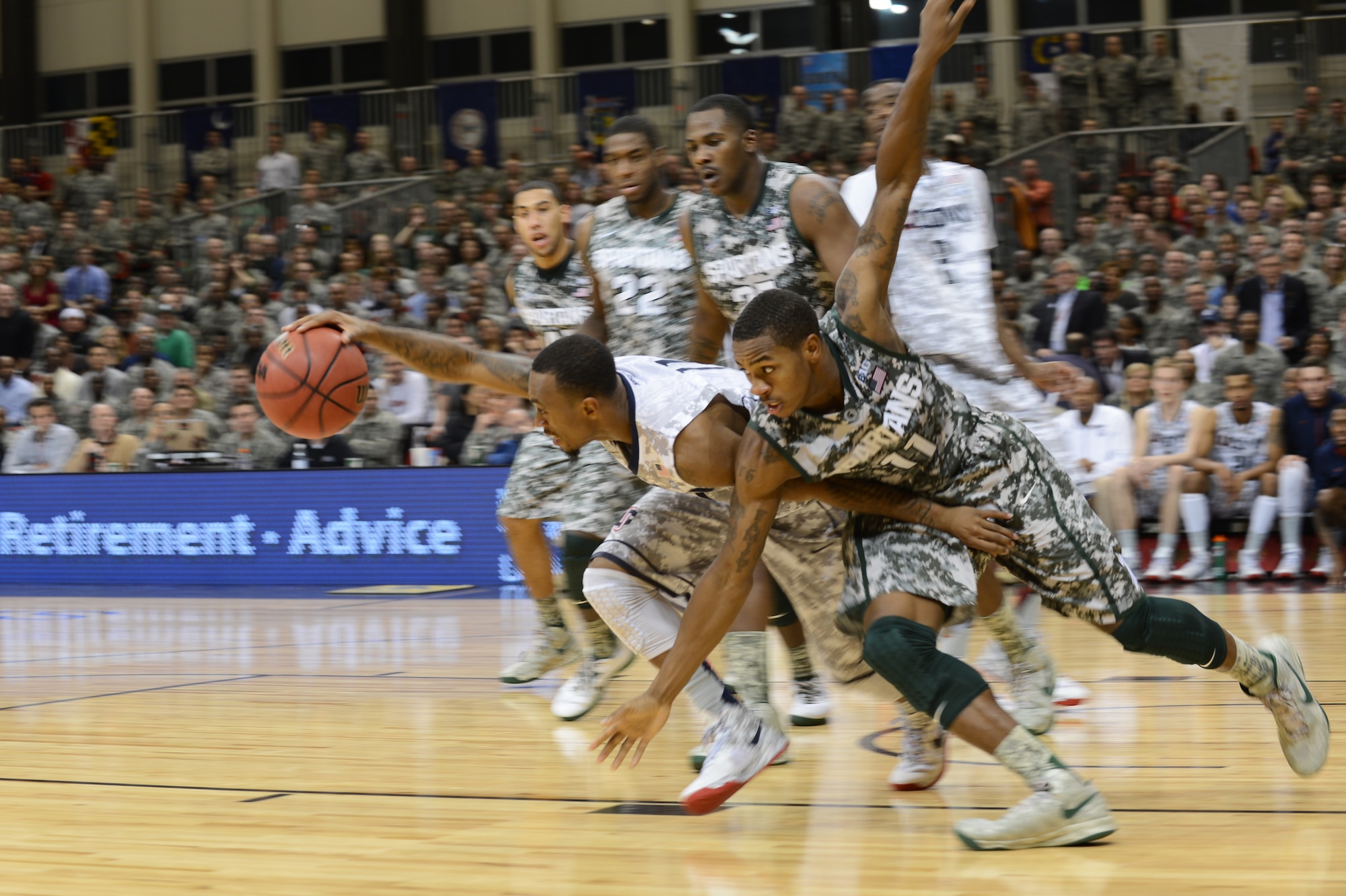 Ryan Boatright, University of Conneticut point guard, defends the ball from an opponent during the 2012 Armed Forces Classic on Ramstein Air Base, Germany, Nov. 10, 2012. The match-up between Michigan State and UCONN is part of ESPN's Veteran's week initiative to honor the men and women who have served and are still serving in the U.S. military. (U.S. Air Force photo/Senior Airman Caitlin O’Neil-McKeown)