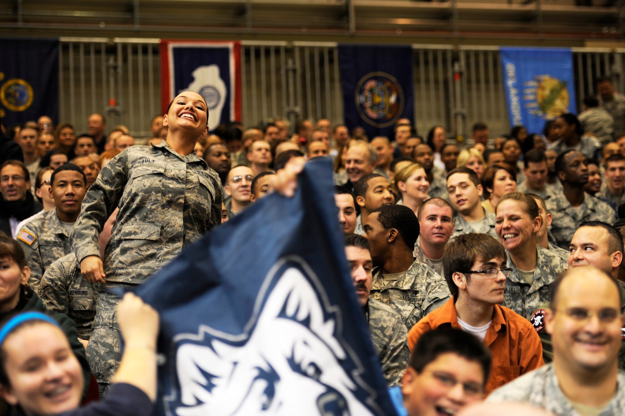 Airmen cheer during the 2012 Armed Forces Classic on Ramstein Air Base, Germany, Nov. 10, 2012. The match-up between Michigan State University and University of Connecticut is part of ESPN's Veteran's week initiative to honor the men and women who have served and are still serving in the U.S. military. (U.S. Air Force photo/Senior Airman Aaron-Forrest Wainwright)