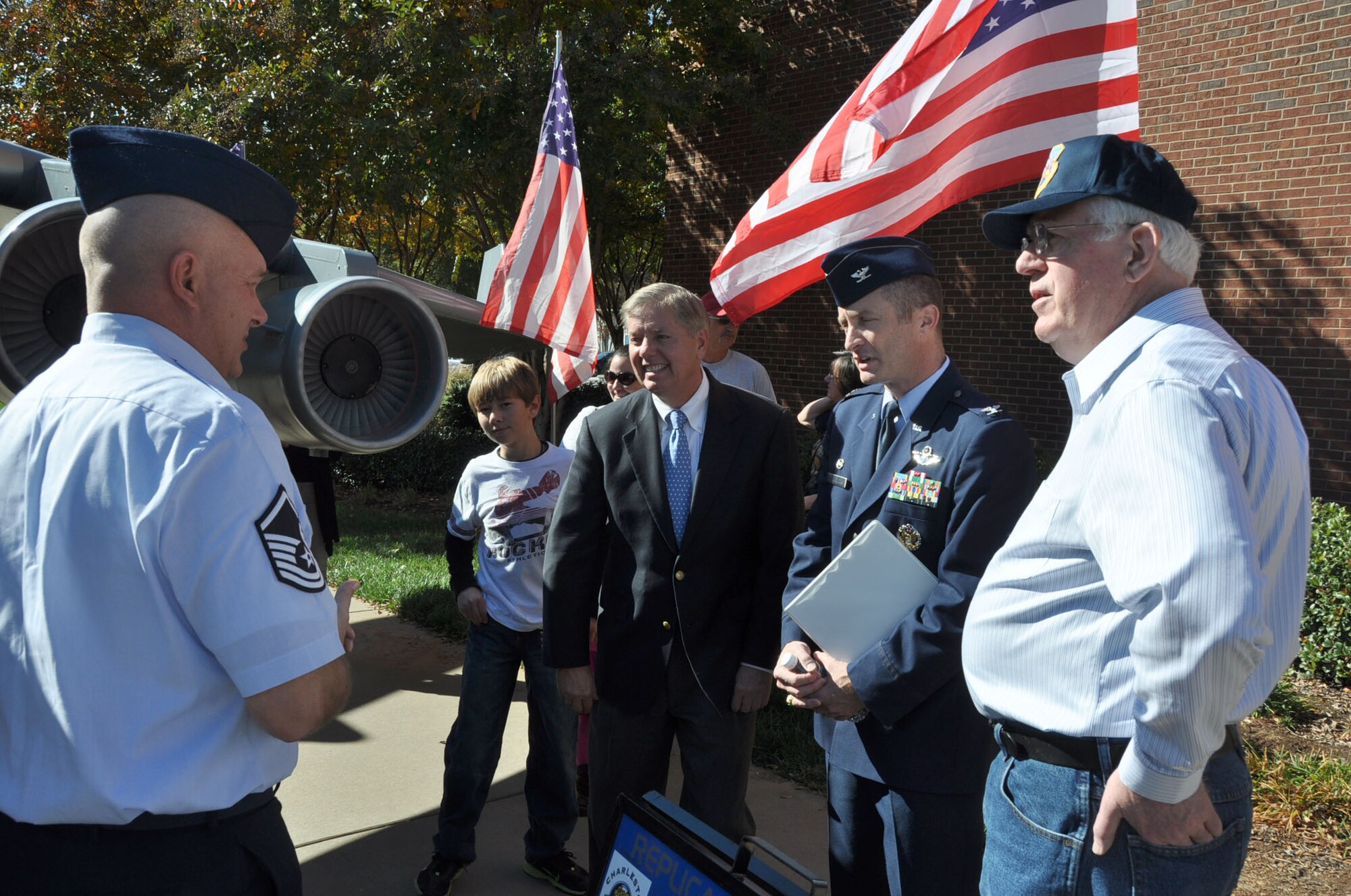 Master Sgt. Chris Fabel, one of the creators of the mini C-17 and 315th Aircraft Maintenance Squadron crew chief, discusses how the mini came to be with S.C. Sen. Lindsey Graham and Col. James J. Fontanella, 315th Airlift Wing Commander, during the Veterans Day weekend celebration at the Upcountry History Museum Saturday, Nov. 10, 2012 in Greenville, S.C. (U.S. Air Force photo/Senior Airman Bobby Pilch)