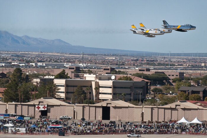 Three F-86 Sabres of the Horsemen Flight Team fly over the crowd while performing an aerial demonstration at Aviation Nation Nov. 11, 2012, at Nellis Air Force base, Nev. The F-86 played a pivotal role for the U.S. in the Korean Conflict. (U.S. Air Force photo by Staff Sgt. Christopher Hubenthal)