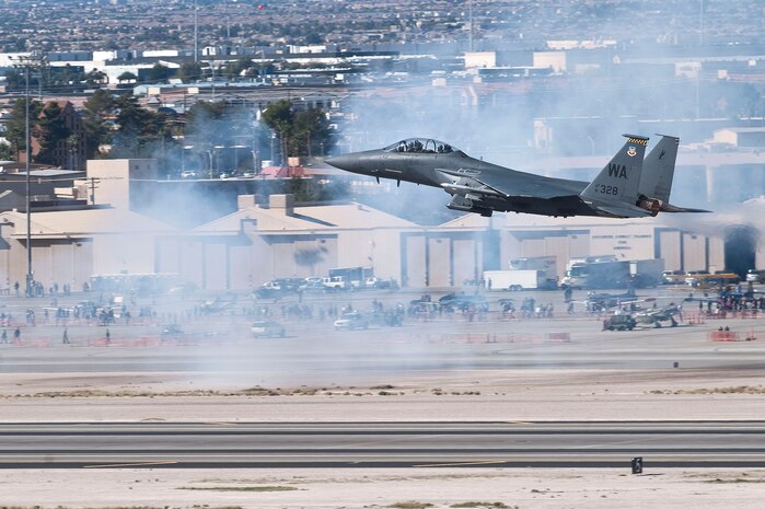 An F-15E Strike Eagle takes off to perform an aerial demonstration during Aviation Nation Nov. 11, 2012, at Nellis Air Force Base, Nev. The F-15E Strike Eagle was one aircraft participating in a ground extraction demonstration where the aircraft involved engage simulated aggressors. (U.S. Air Force photo by Staff Sgt. Christopher Hubenthal)