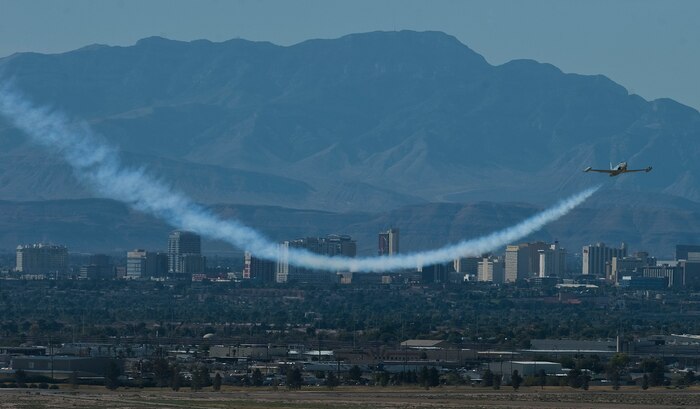 A T-33 Shooting Star performs an aerial demonstration during Aviation Nation at Nellis Air Force Base, Nev. The T-33 Shooting Star is an American built jet trainer aircraft and is showcased at the Air Mobility Command Museum. (U.S. Air Force photo by Staff Sgt. Christopher Hubenthal)