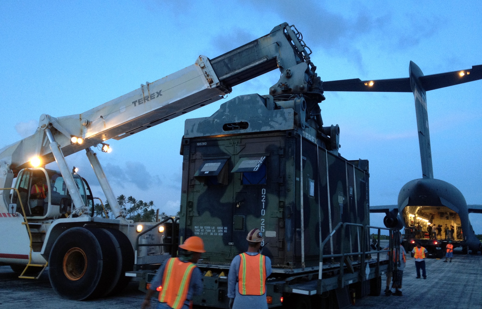 Ground crews at Bucholz Army Airfield, Kwajalein Atoll, U.S. Marshall Islands, position equipment from a recent ballistic missile defense system test for loading aboard an awaiting C-17 Globemaster III from the 535th Airlift Squadron at Joint Base Pearl Harbor-Hickam, Hawaii, Nov. 8. The aircrew redeployed over 630-thousand pounds of equipment from the South Pacific to locations in Asia and the United States mainland over an 11 day period, flying up to 22-hours per day and covering nearly 32-thousand miles. (U.S. Air Force photo by Capt. Ben Sakrisson)